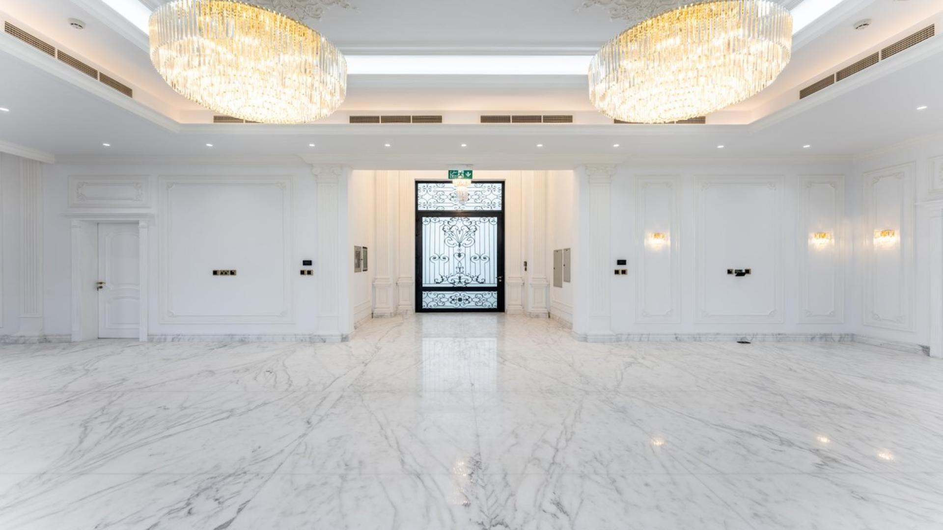 Luxurious marble-floored villa interior with chandeliers on Pearl Jumeirah, Jumeirah