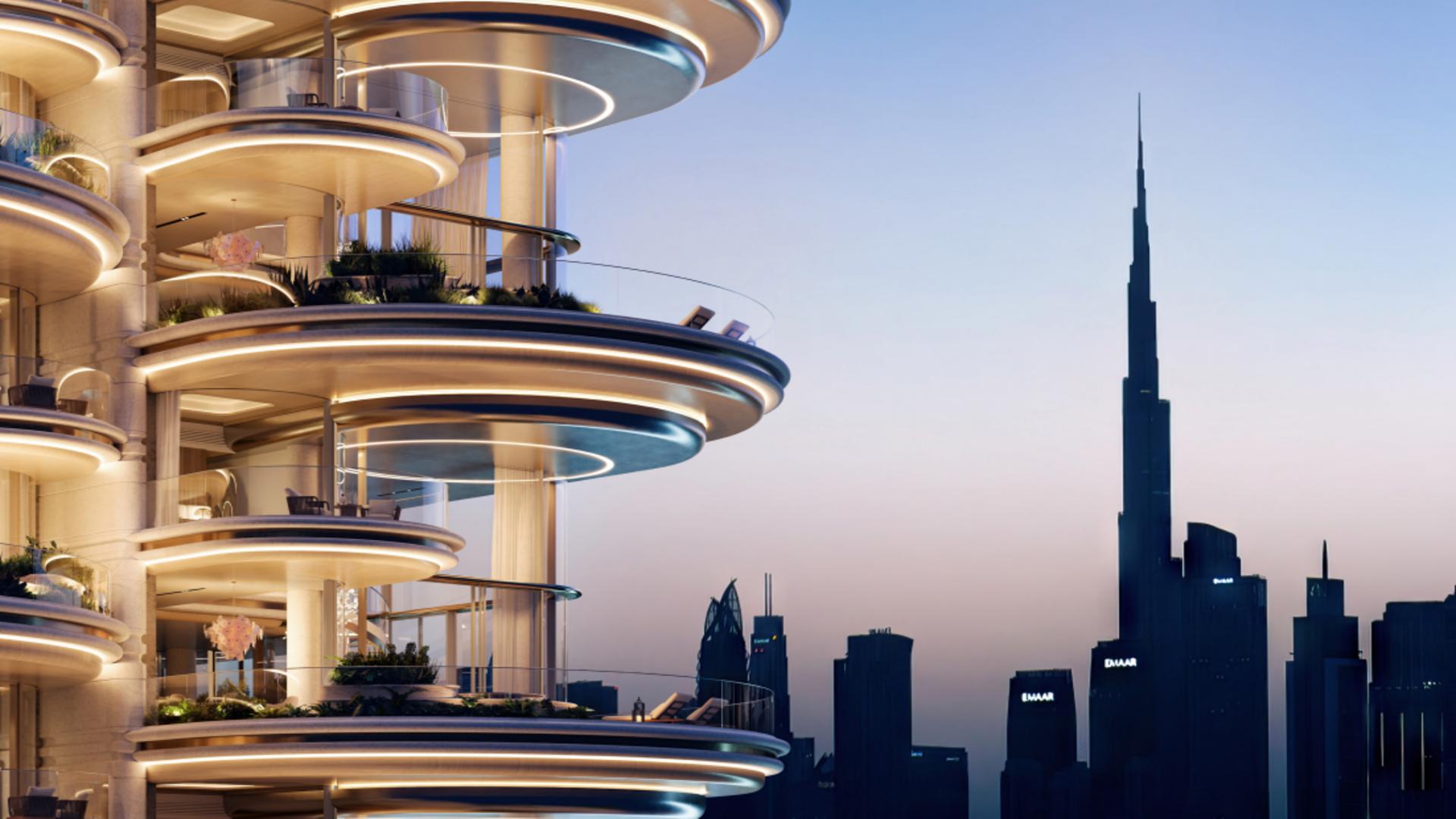 Luxurious living room in seven-bedroom Jumeirah apartment with spiral staircase and city view