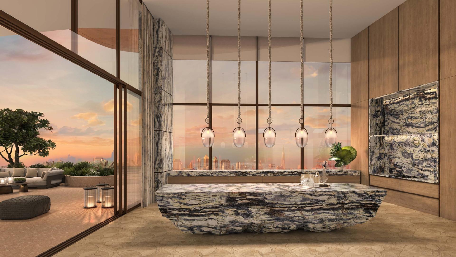 Luxurious Jumeirah Asora Bay penthouse lounge with stunning sunset views and elegant decor