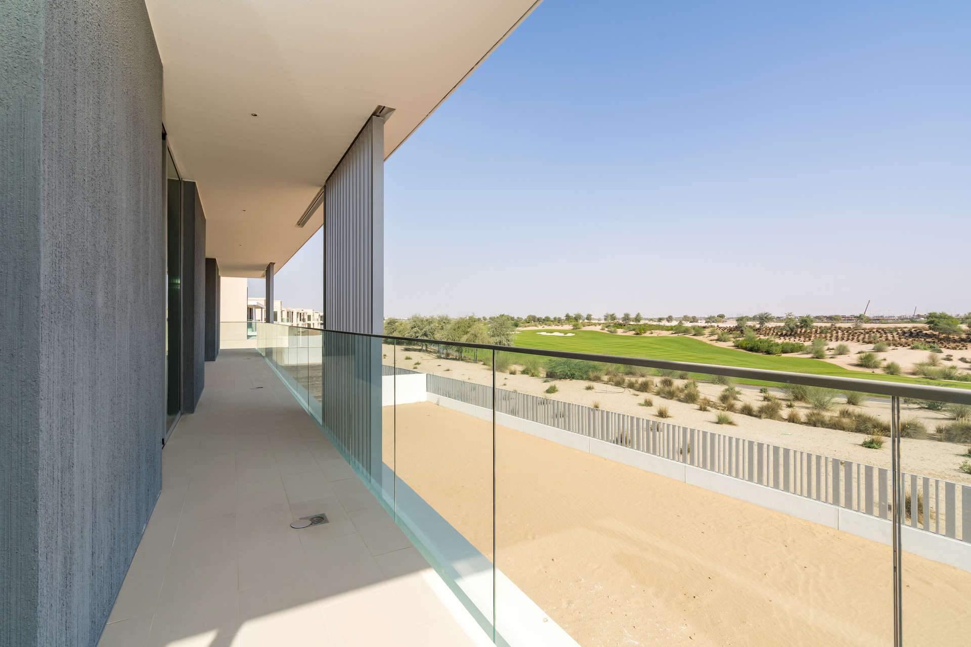 Spacious living room with large windows in Dubai Hills Estate villa for rent