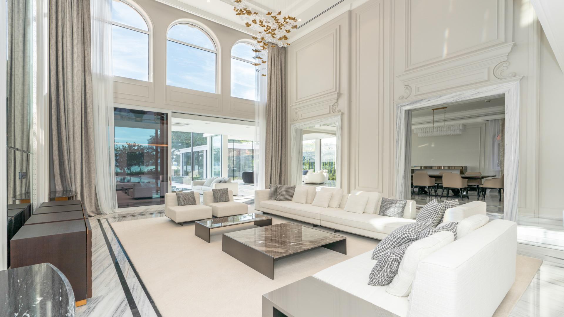 Luxurious living room in XXII Carat Villa, Palm Jumeirah, with elegant furnishings and high ceilings
