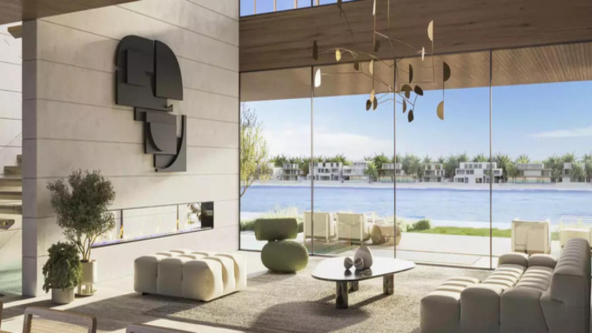 Expansive seven-bed villa exterior in Palm Jebel Ali, surrounded by lush greenery and palms