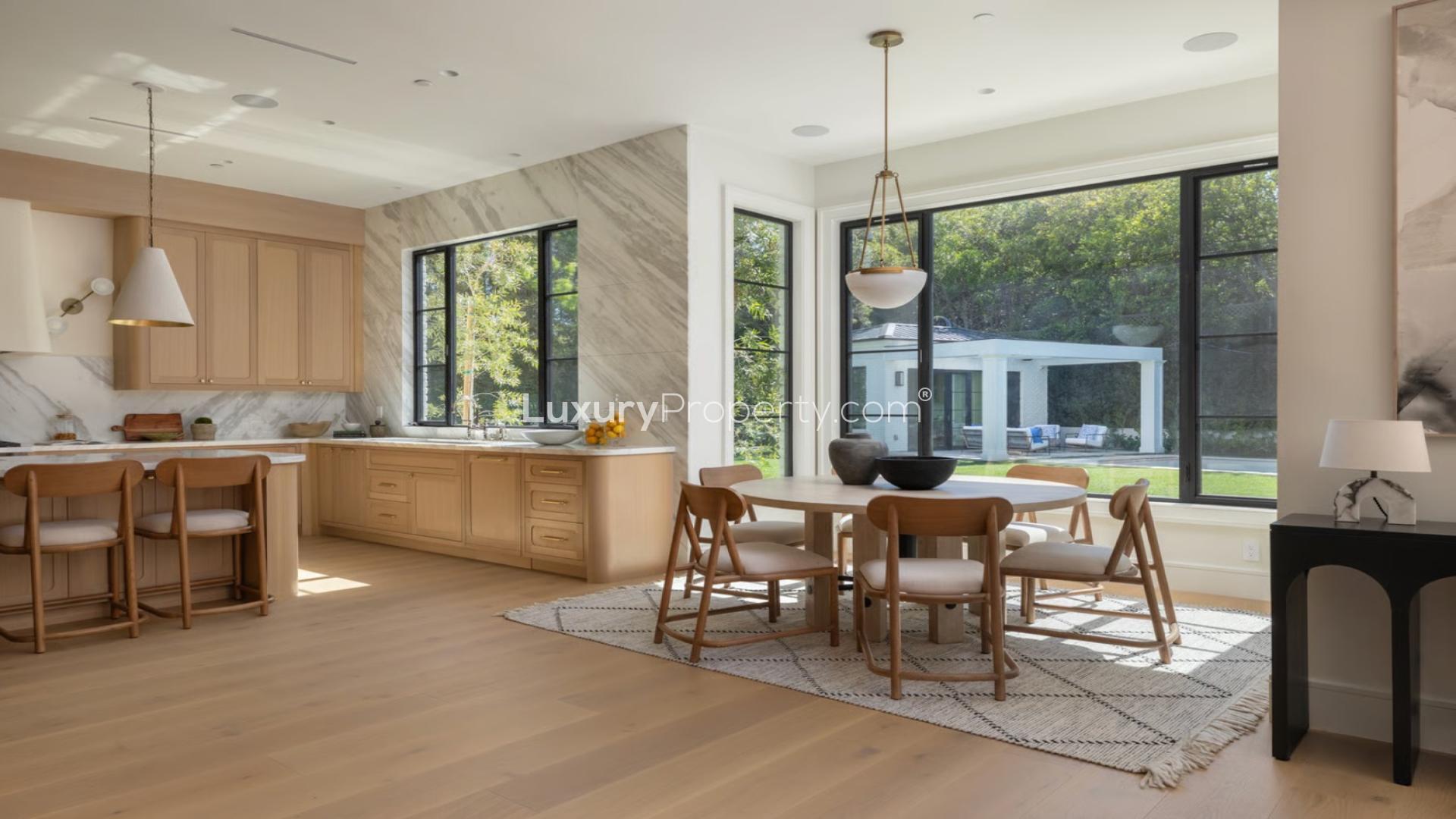 Luxurious Brentwood Park villa with pool and spacious outdoor area at dusk, for sale