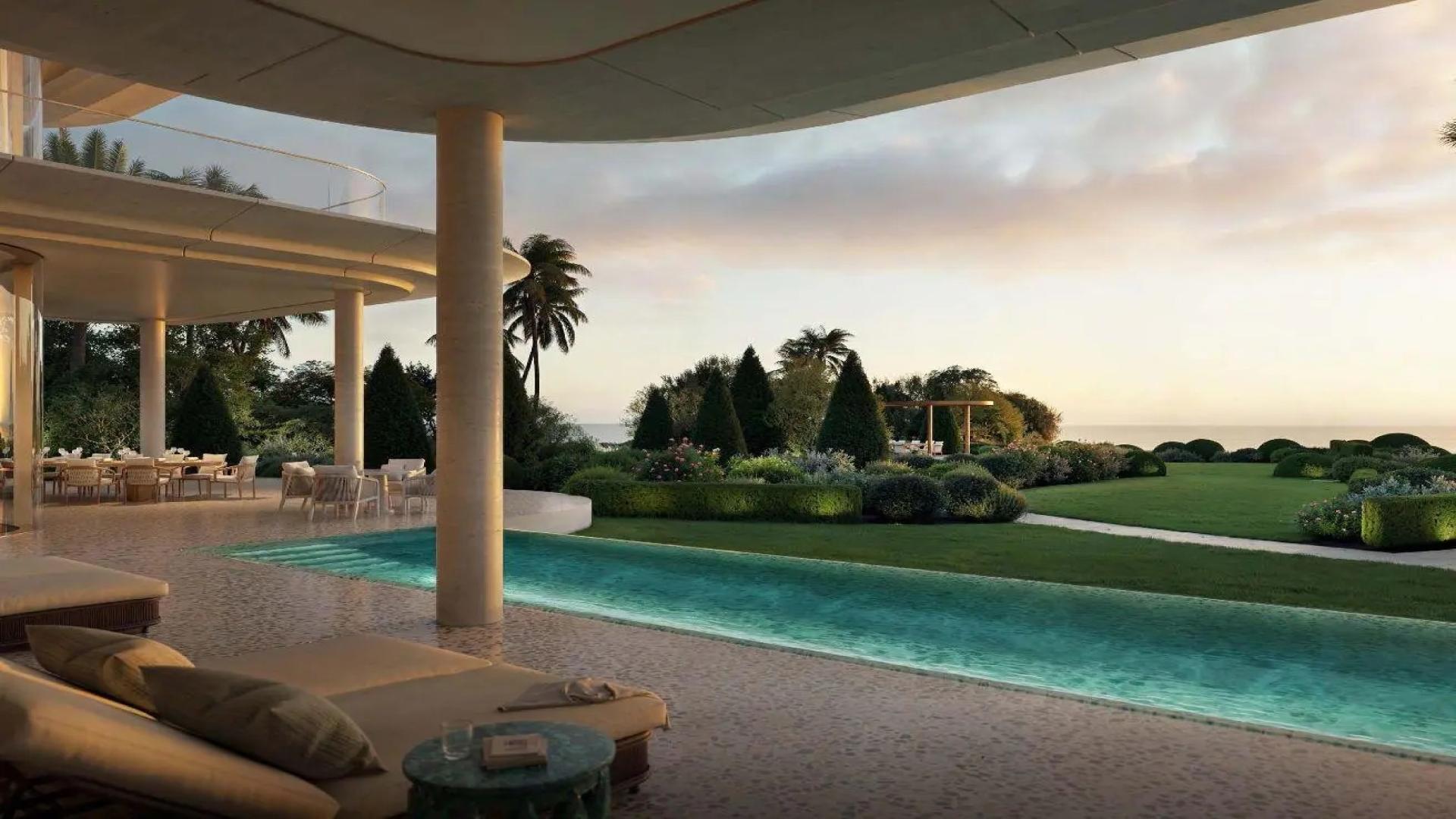 Luxurious Jumeirah Asora Bay villa bedroom with ocean view, modern decor, and elegant furnishings