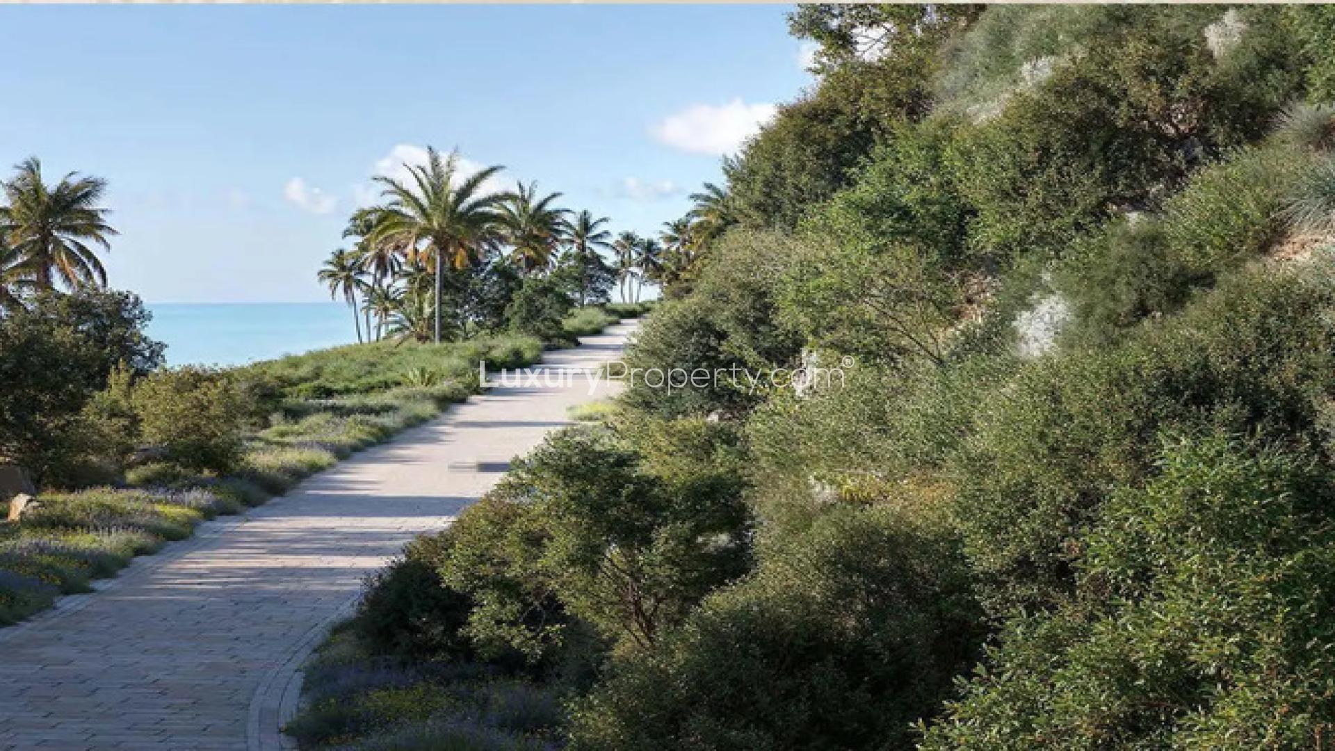 Luxurious living room in Jumeirah Asora Bay villa, featuring elegant furniture and sea views