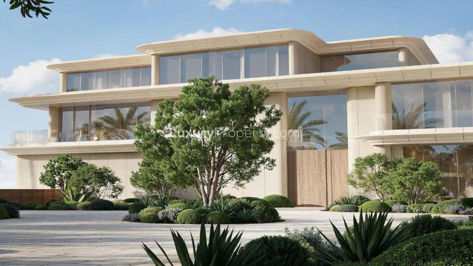 Ultra luxury villa exterior with lush garden and pool in Jumeirah Asora Bay