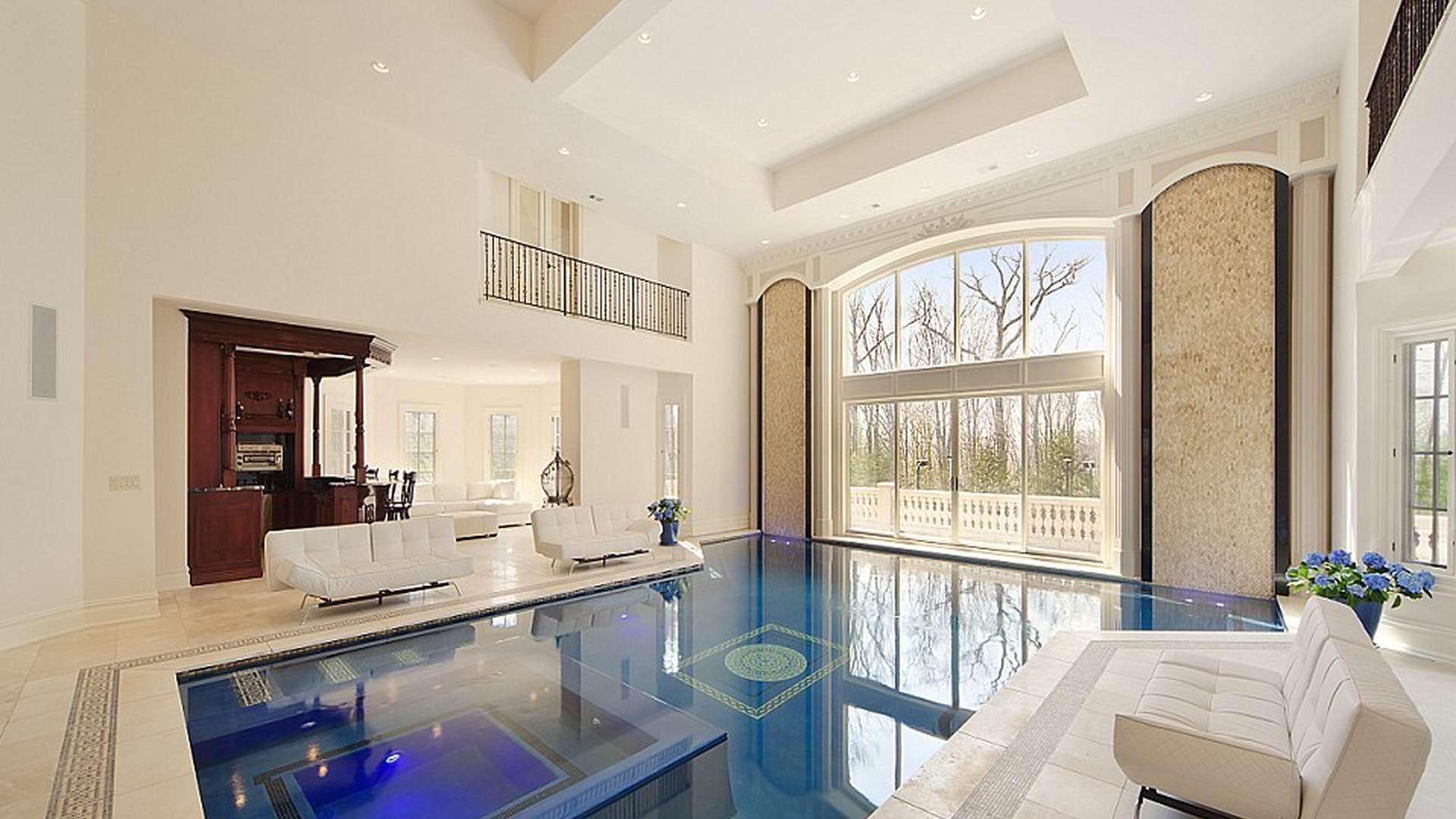 Luxurious grand foyer in Saddle River mansion with elegant chandelier and ornate details