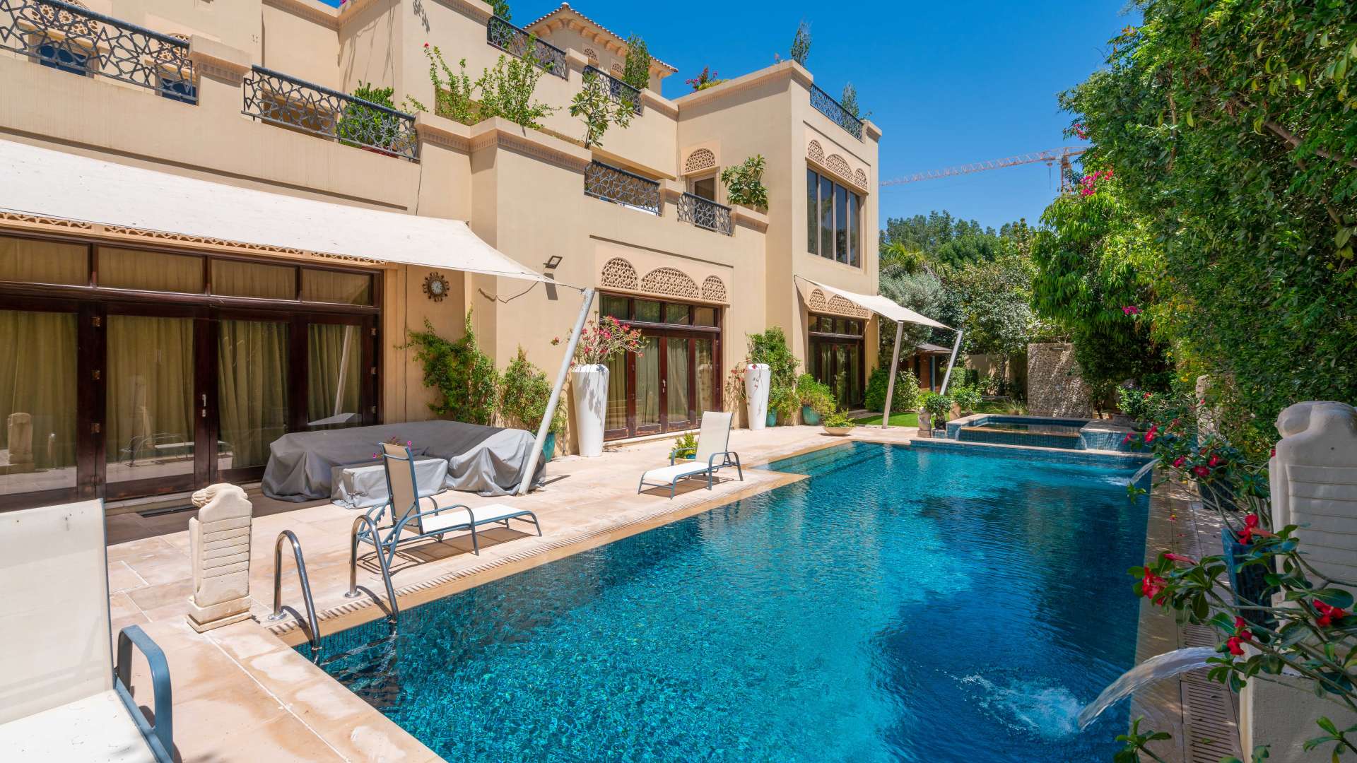 Spacious living room with large windows in Al Barari Acacia Villas, Dubai corner plot villa