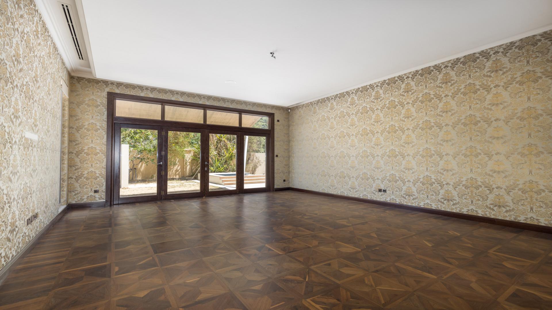 Spacious living area with pool view in Al Barari villa for rent, 7 bedrooms