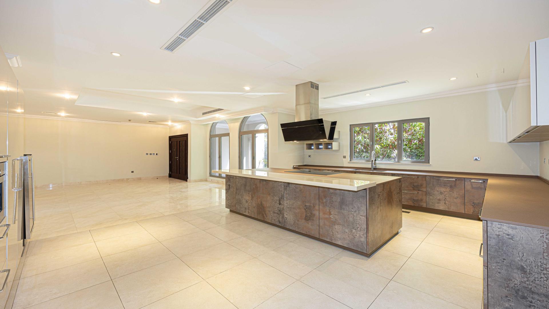 Spacious modern kitchen in Palm Jumeirah Signature Villa for rent, featuring sleek finishes