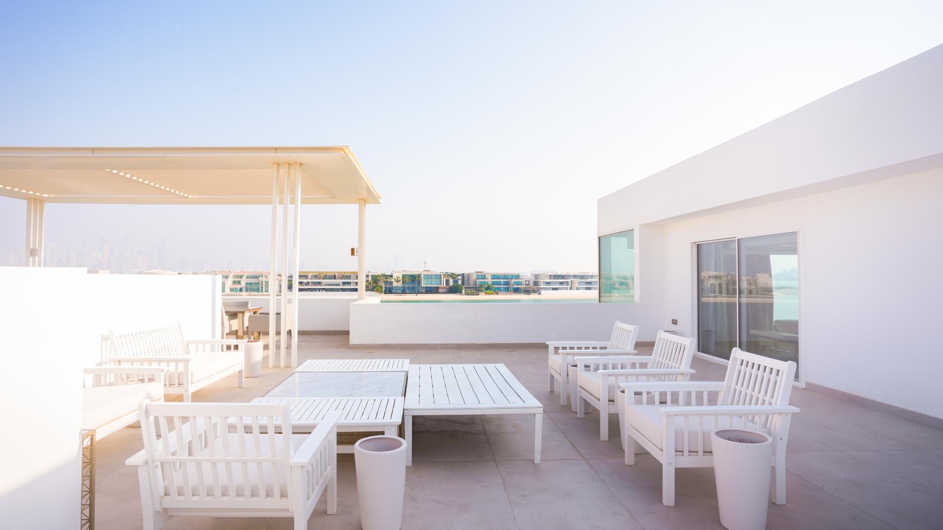 Luxurious outdoor seating area at Palm Jumeirah Signature Villa, Dubai residential property for sale