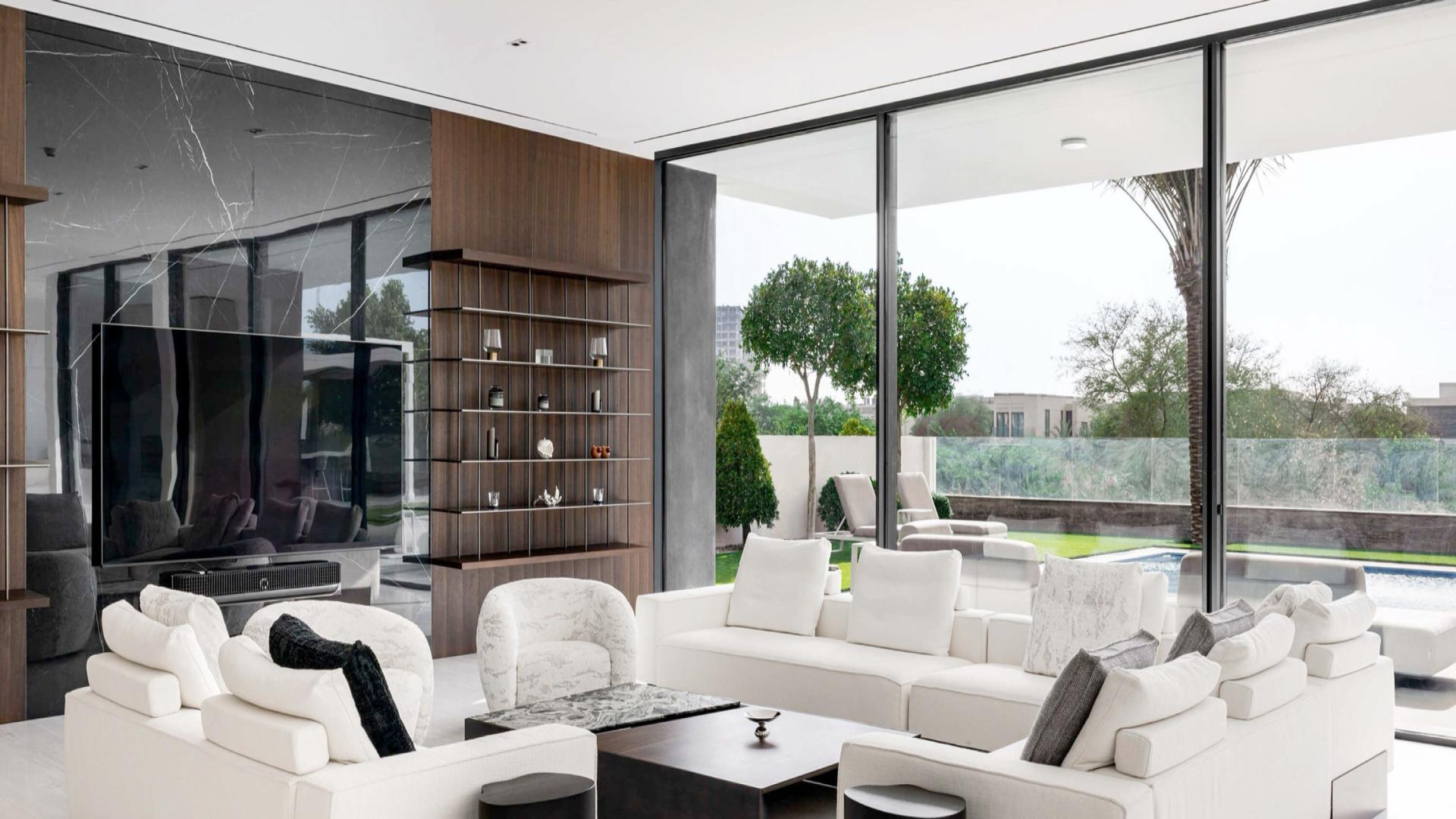 Luxury living room with pool view in Emerald Hills villa, Dubai Hills Estate