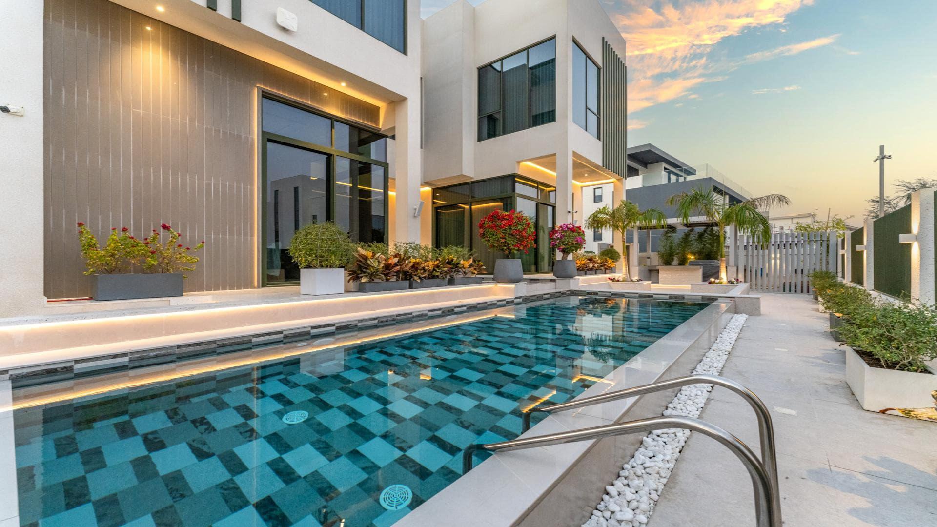 "Luxury villa exterior with pool at sunset, Emerald Hills, Dubai Hills Estate, for sale.",Luxury villa with modern pool in Emerald Hills, Dubai Hills Estate, for sale
