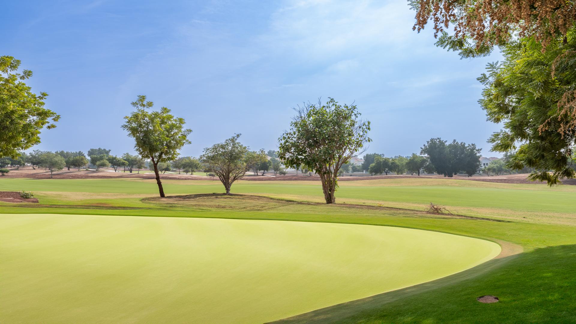 Golf course view from villa in Wildflower, Jumeirah Golf Estates, sunny day