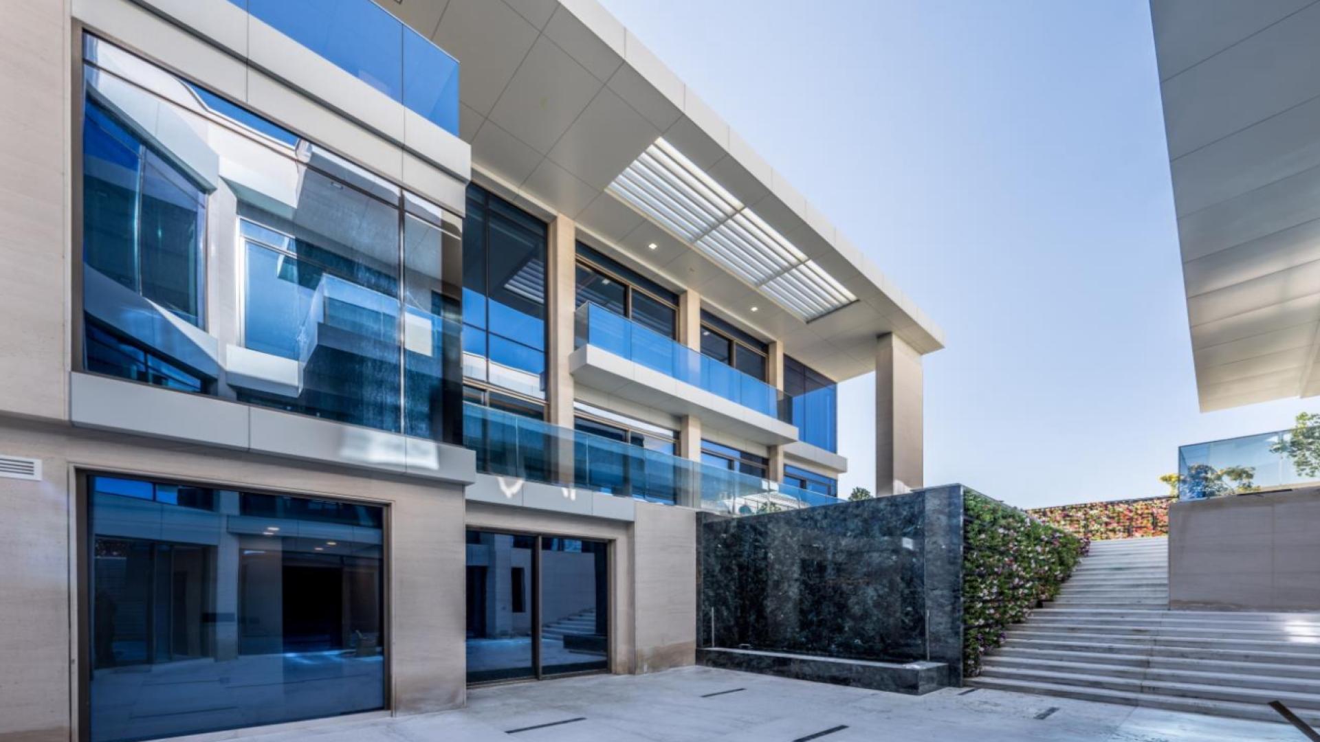 Elegant Pearl Jumeirah villa exterior with modern design, featuring spacious architecture and landscaped entrance