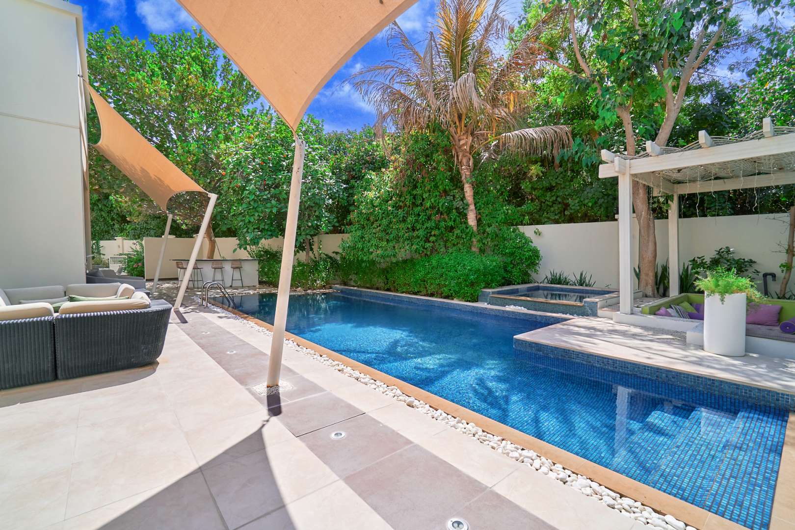 Home theater in luxury 7-bed villa, Al Barari, Dubai, with red seating and unique decor