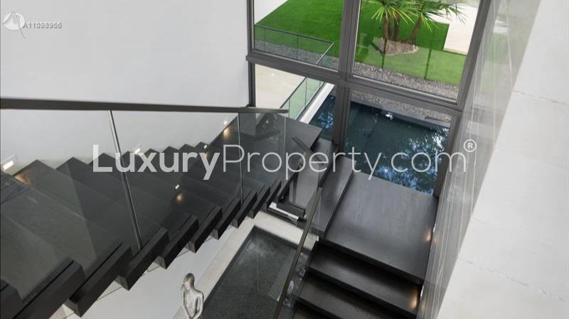 Luxurious villa patio view with glass doors, 5400 Hammock Dr, Coral Gables, Miami