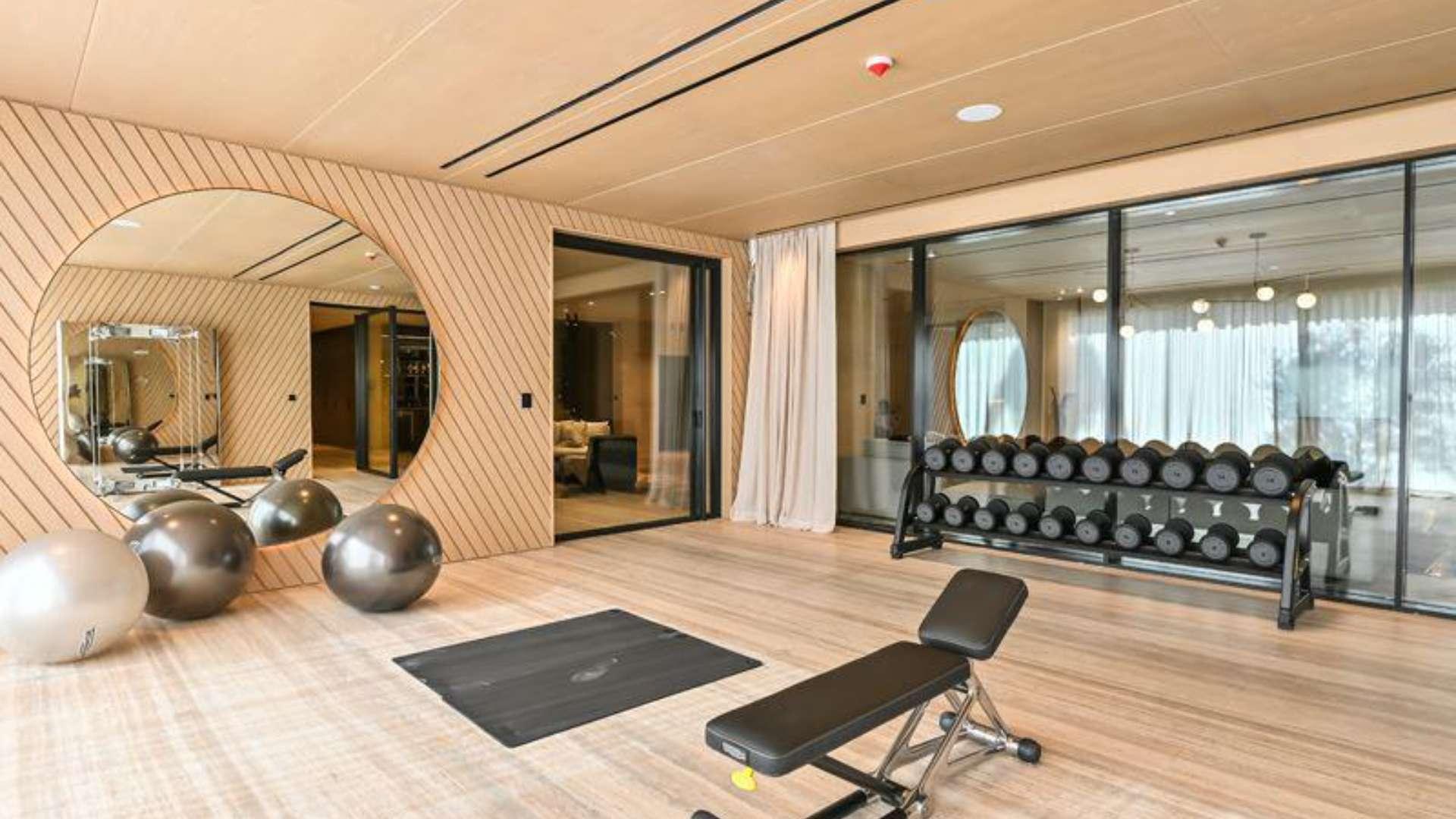 Modern living room in 7-bedroom mansion, Dubai Hills View, featuring elegant decor and spacious design