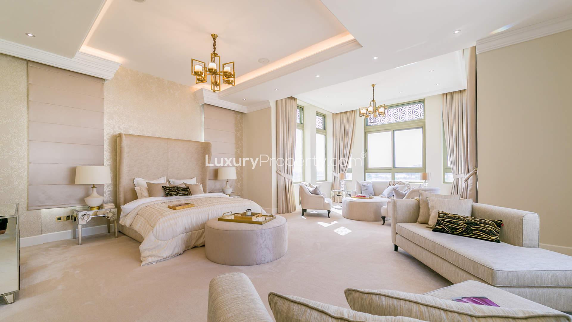 Elegant dining room in 7-bedroom Dubai Hills Grove mansion, featuring luxurious decor and chandelier