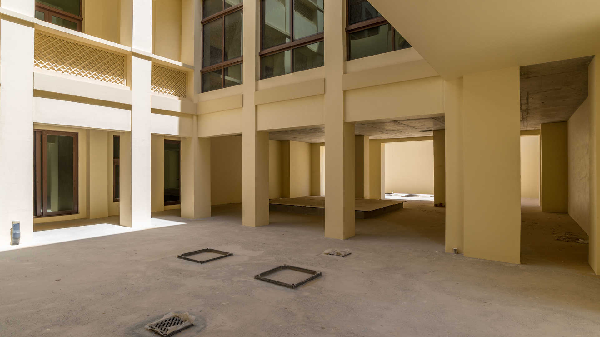 Spacious unfinished interior of 7-bedroom villa in Dubai Hills Estate, large windows and open space