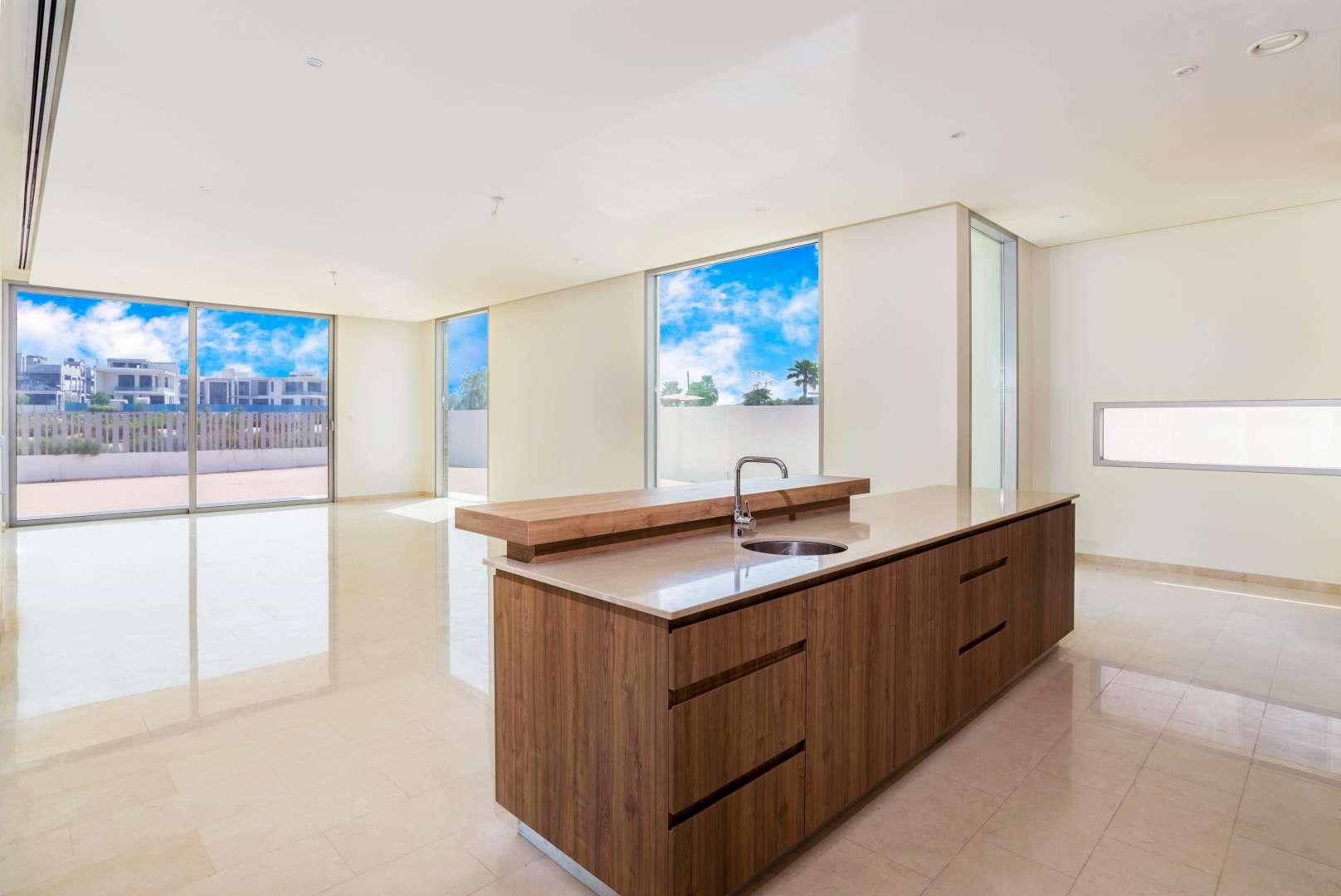 Luxurious kitchen in 7-bed villa, Dubai Hills Vista, with large windows and island counter