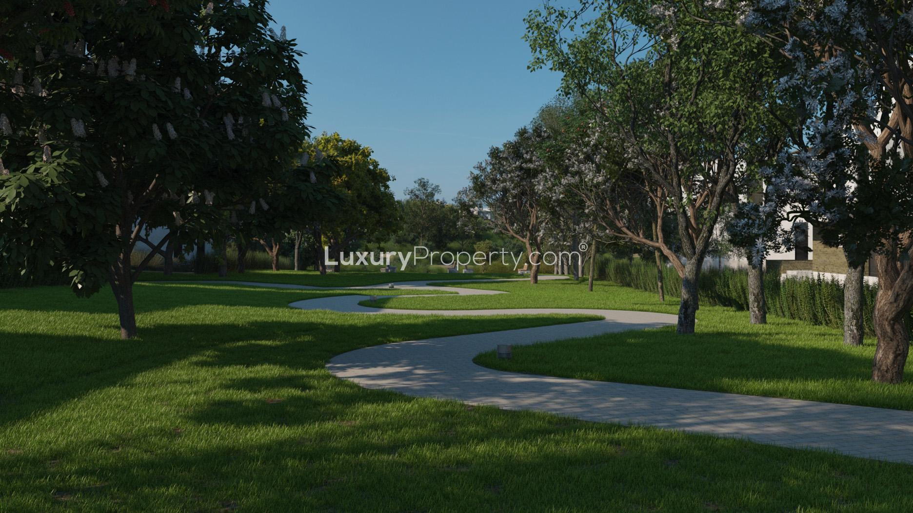 Luxurious 7-bedroom villa exterior with lush landscaping in Eighteen, Islamabad, Pakistan