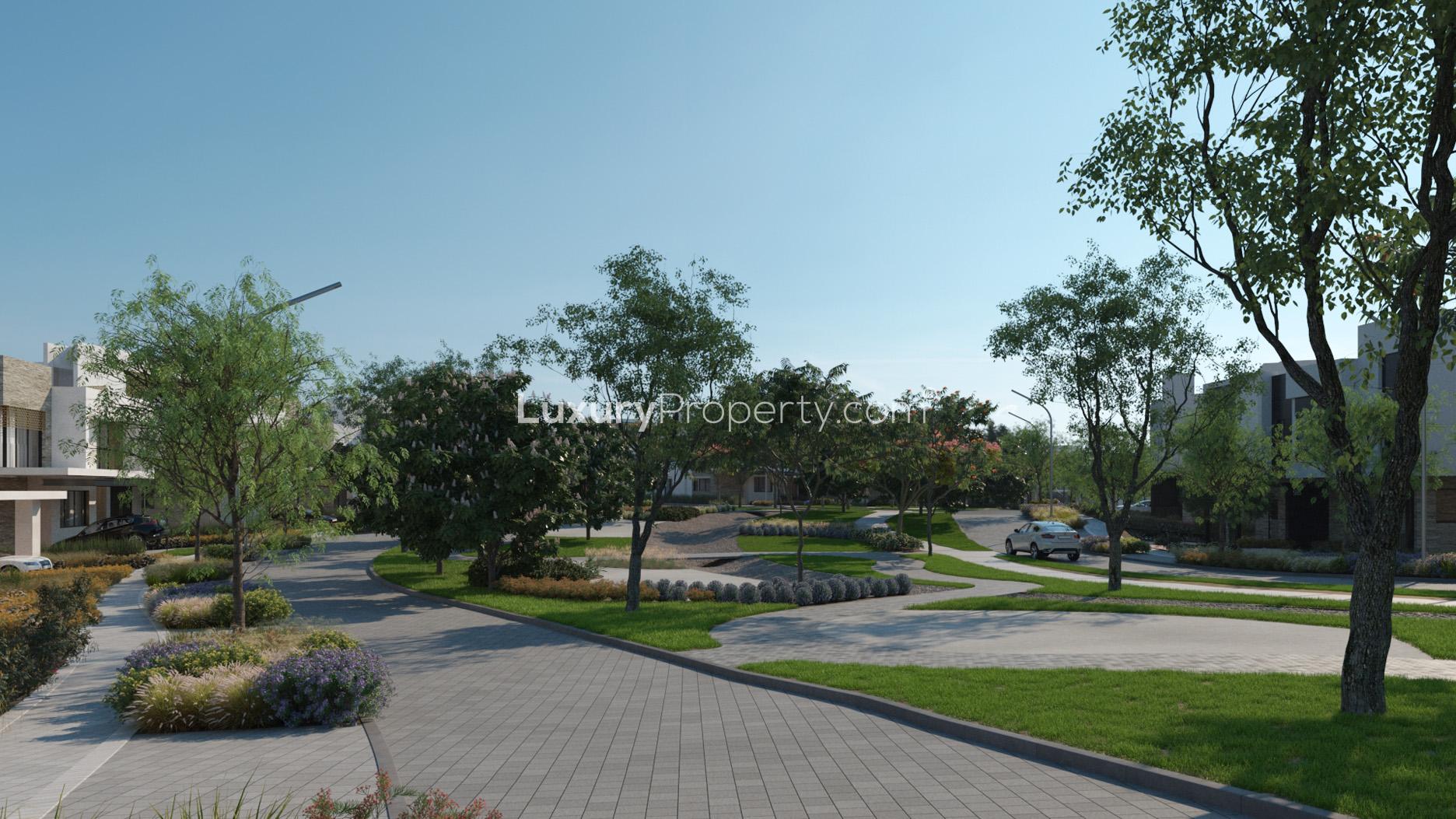 Luxurious villa in Eighteen, Islamabad overlooking lush golf course and serene water feature