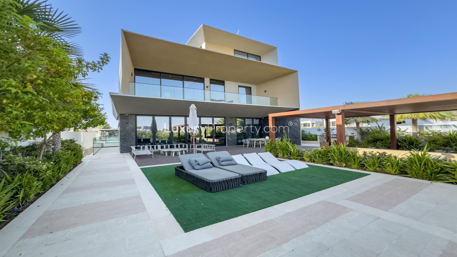 Luxurious 7-bedroom villa exterior with garden in Damac Lagoons