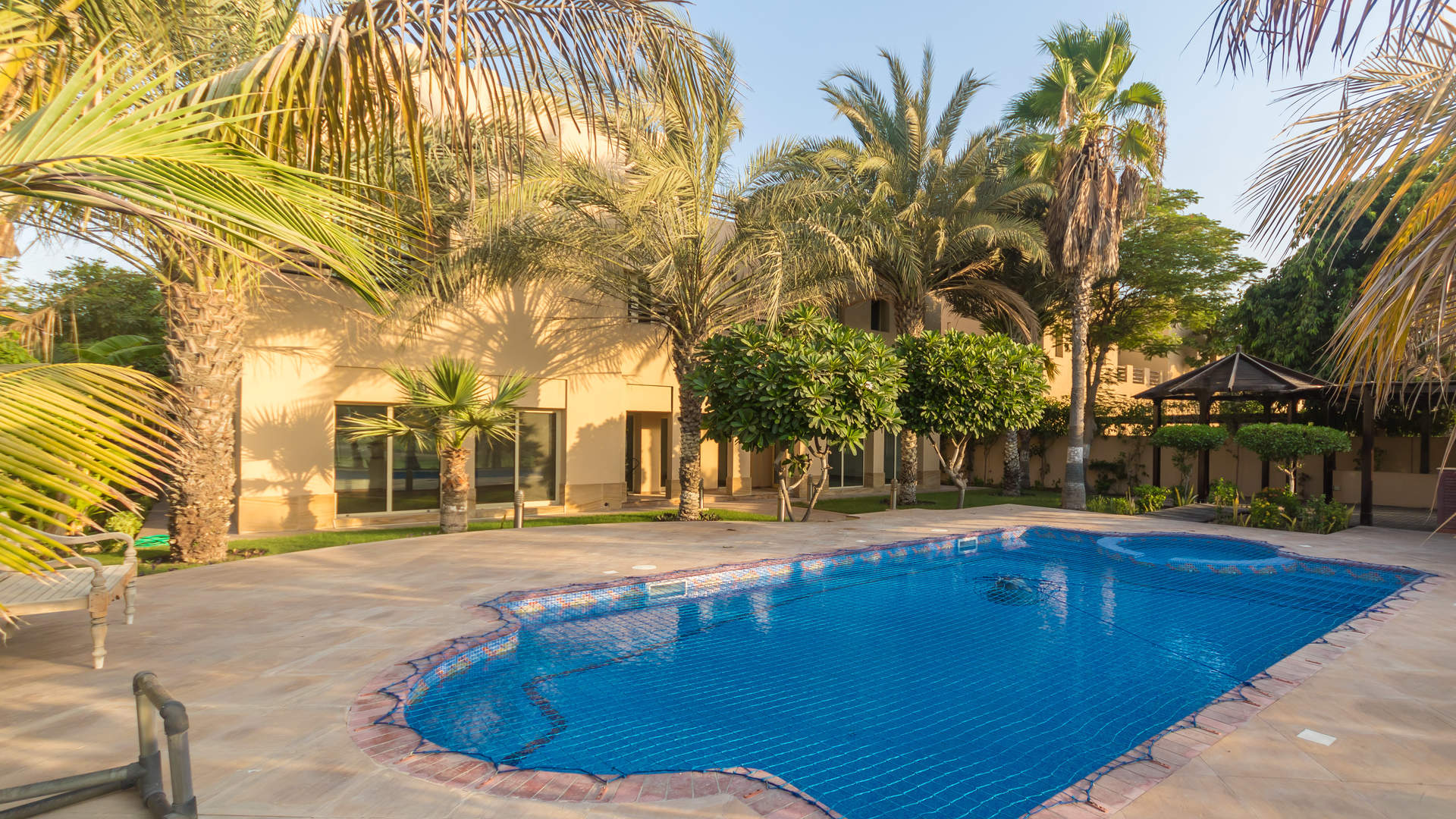 Outdoor patio with pergola and pool view at Hattan Villa, The Lakes, Dubai