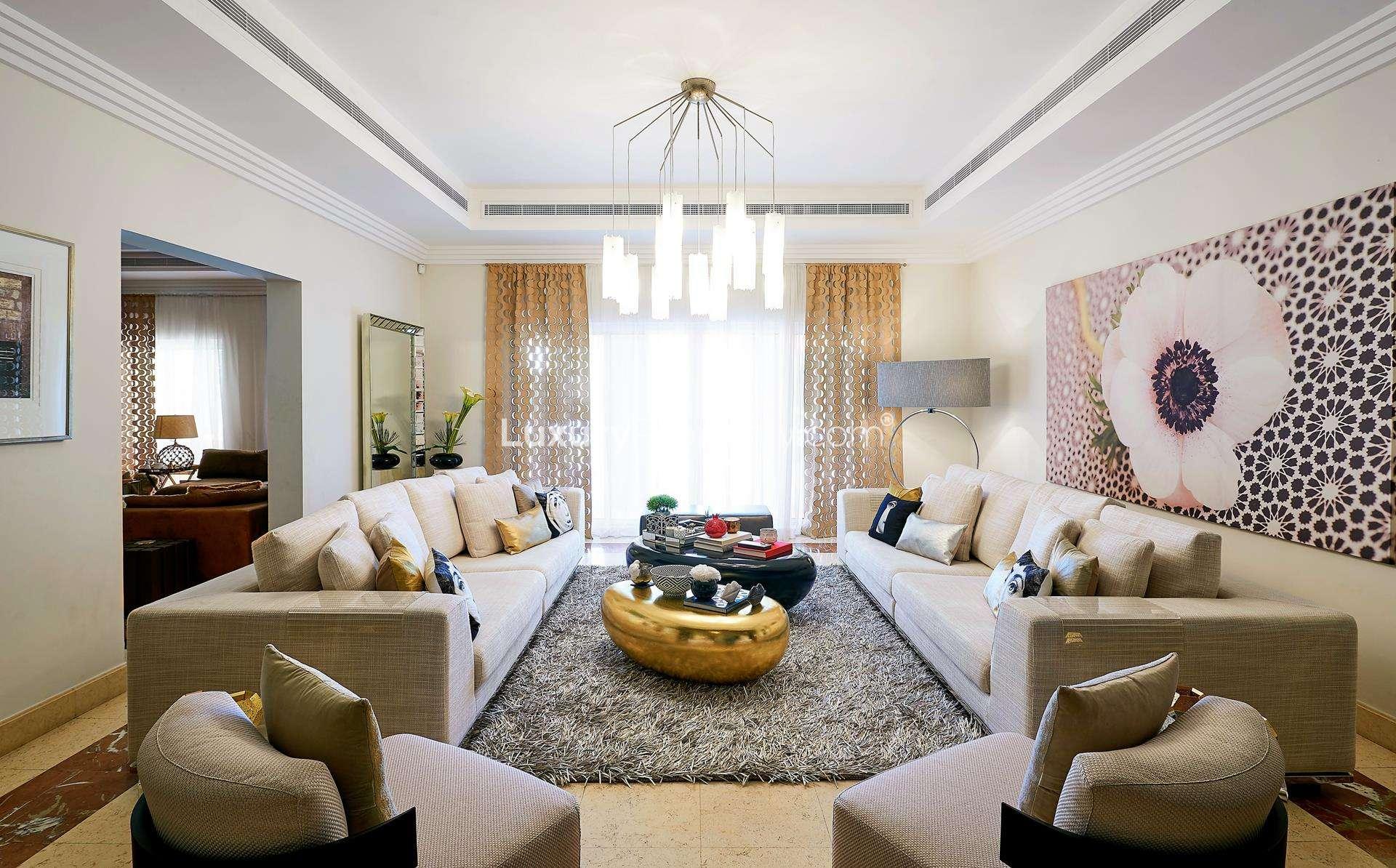 Elegant dining room in 7-bedroom Hattan L2 villa, Arabian Ranches, with stylish decor