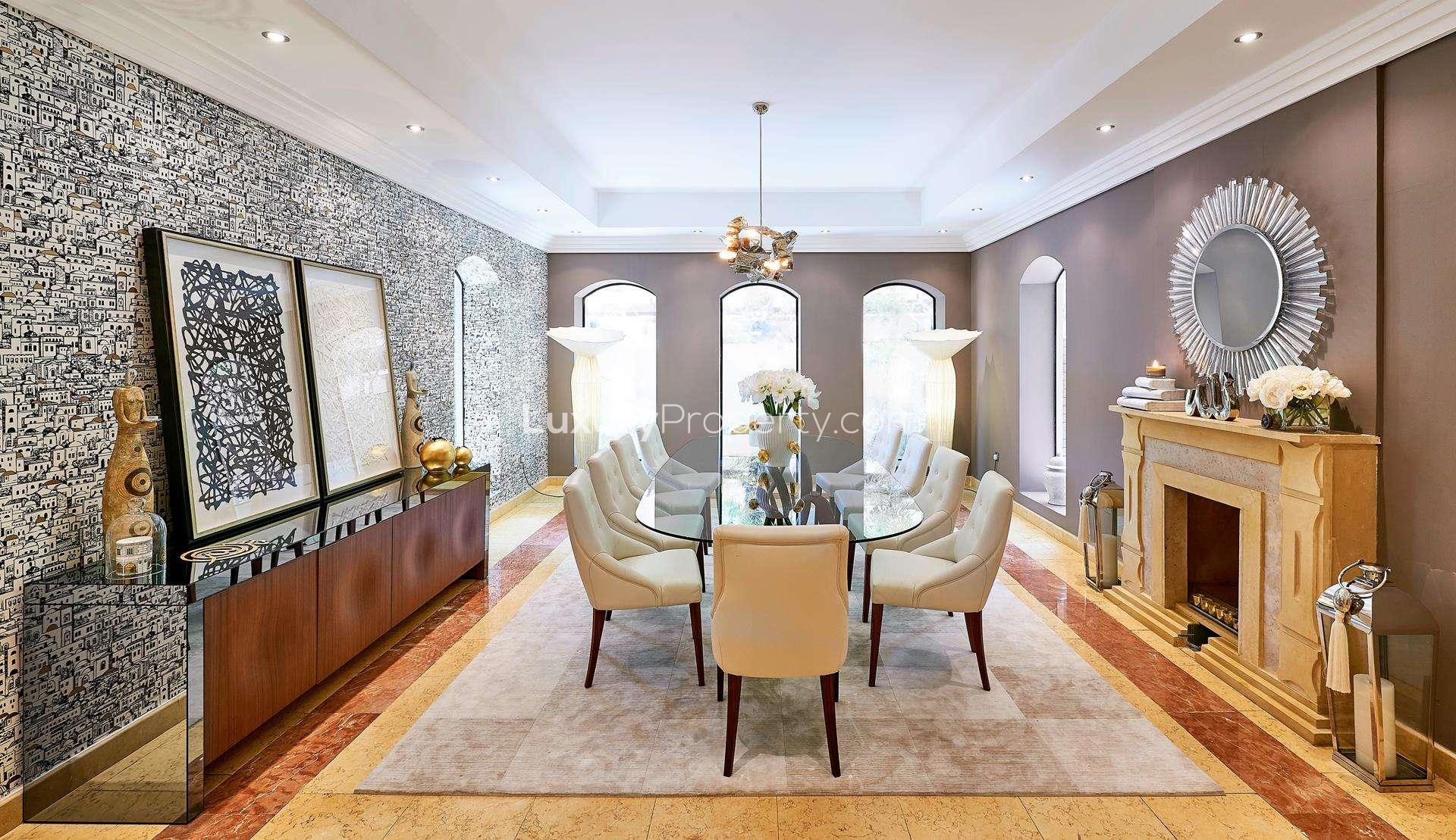 Elegant dining room in 7-bedroom Hattan L2 villa, Arabian Ranches, with modern decor