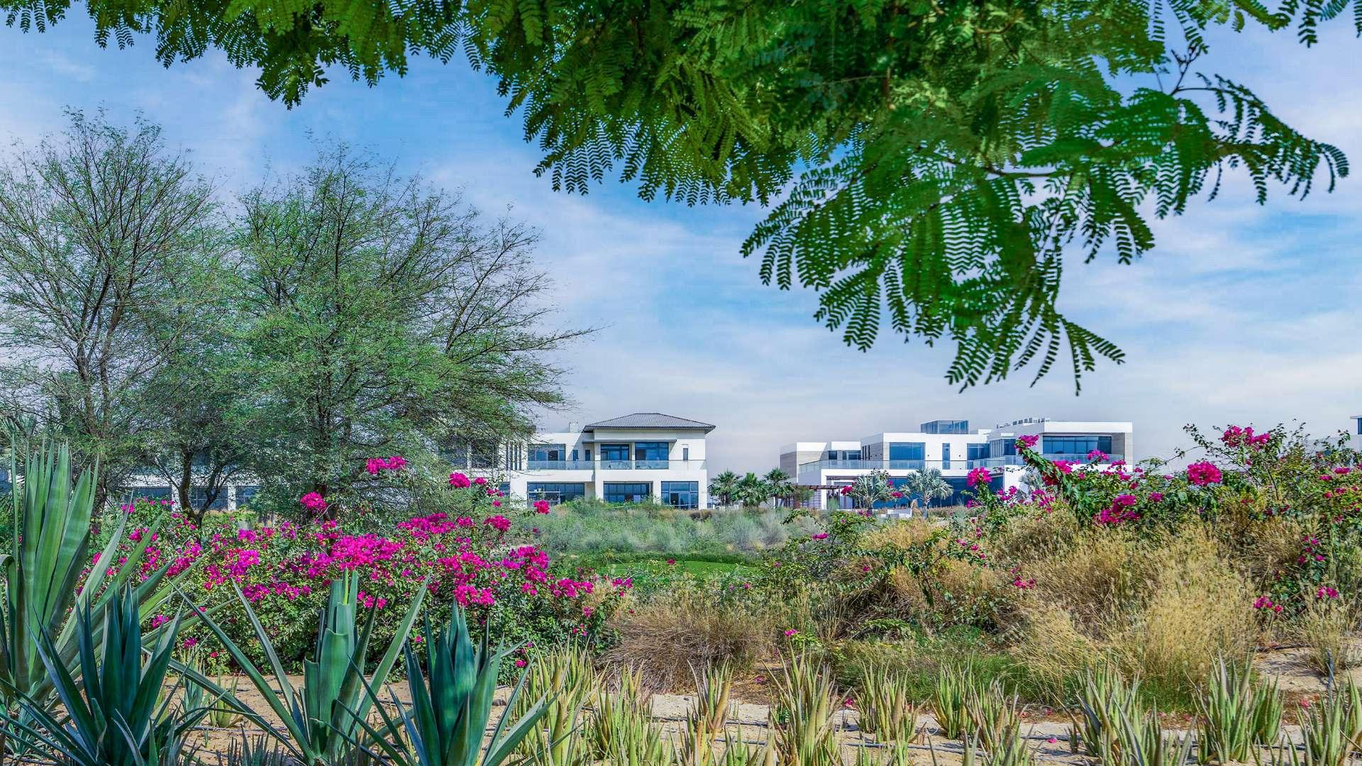 Dubai Hills View villa overlooking lush golf course and tranquil lake scenery