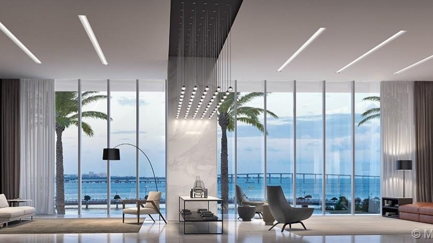 Luxurious Miami Beach penthouse kitchen with sunset view, modern design, and elegant dining area