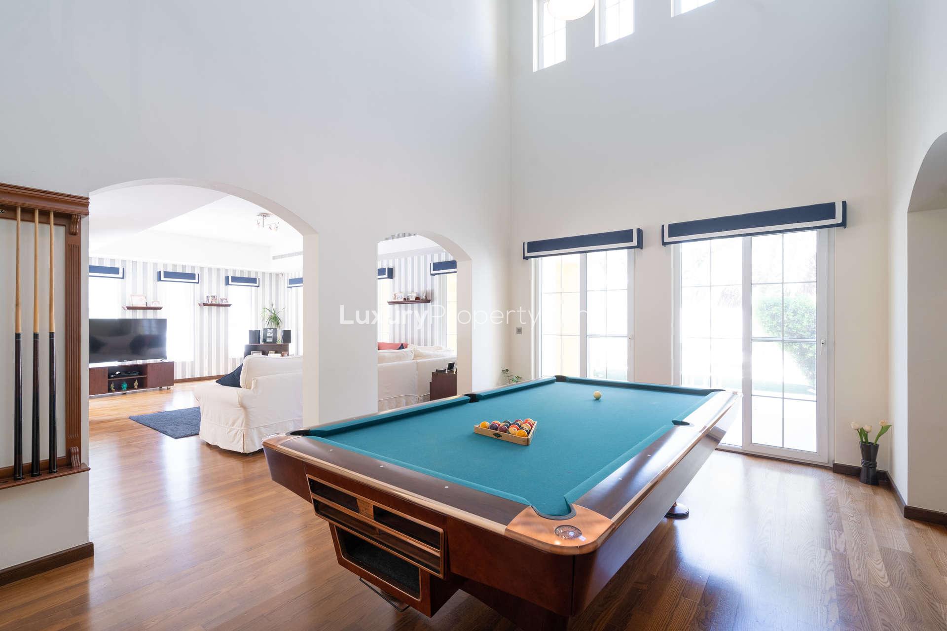 Bright dining area in 7-bedroom villa, Mirador, Arabian Ranches, with wooden table and chairs