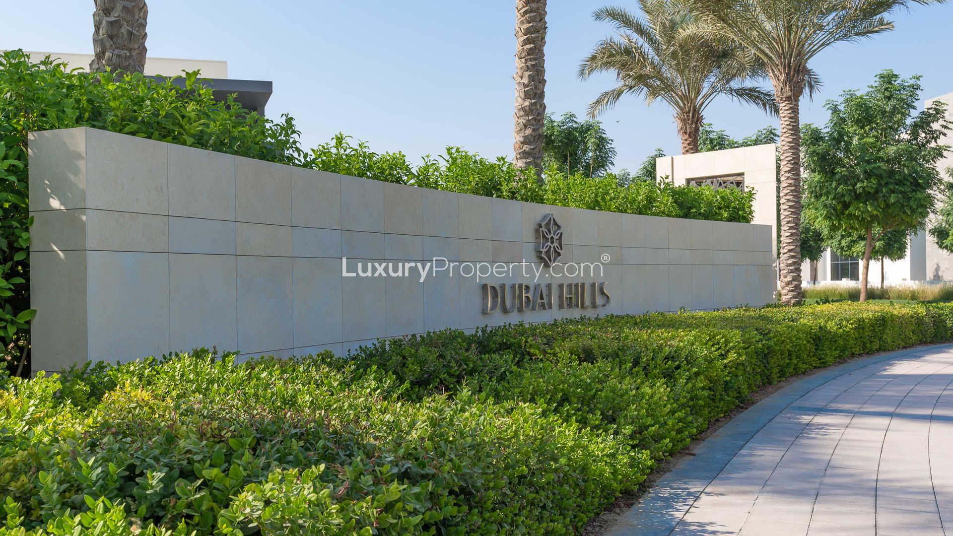 Entrance of Dubai Hills Estate, showcasing modern architecture and lush landscaping