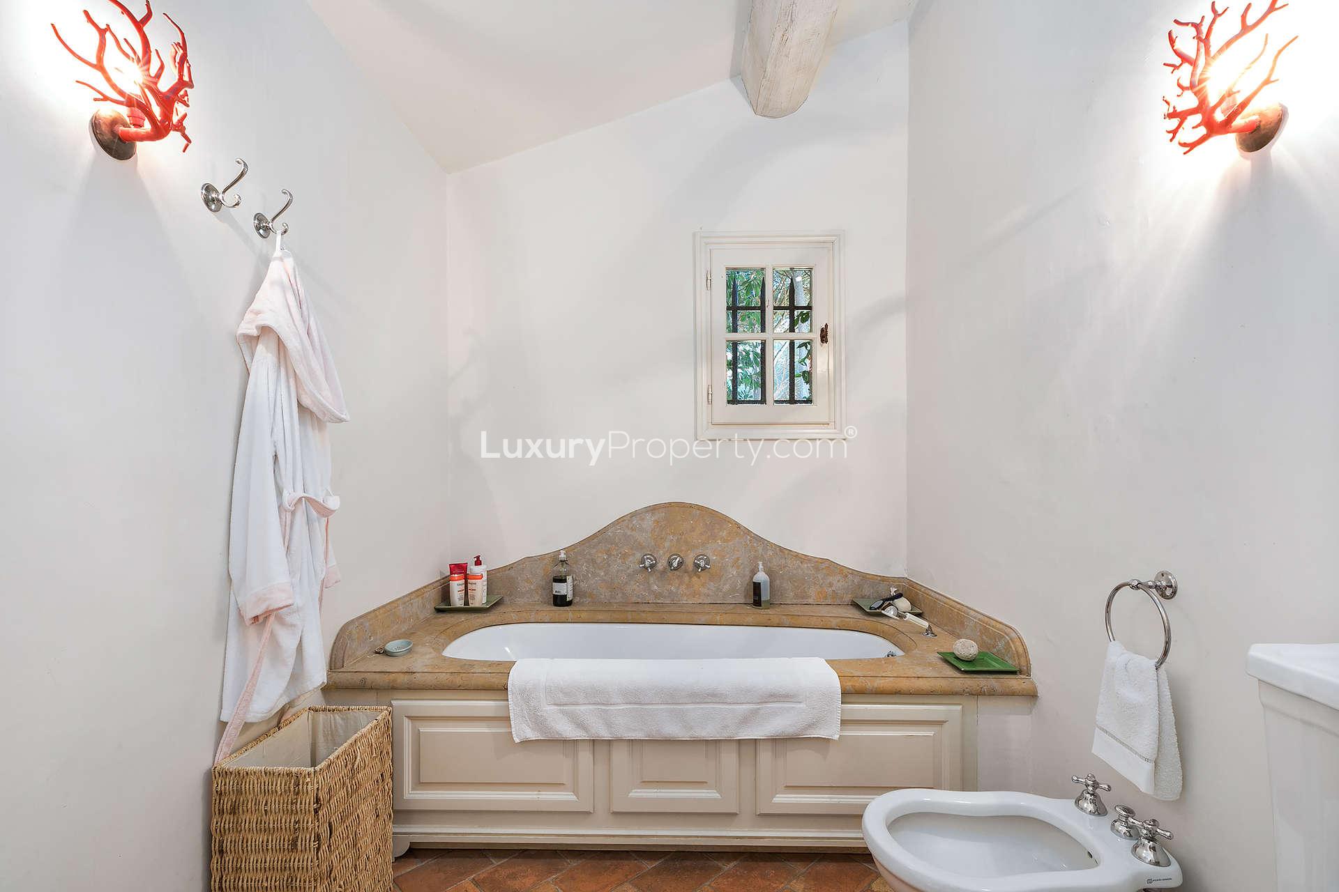 Elegant bathroom with luxurious bathtub in 7-bedroom Ramatuelle villa, French Riviera