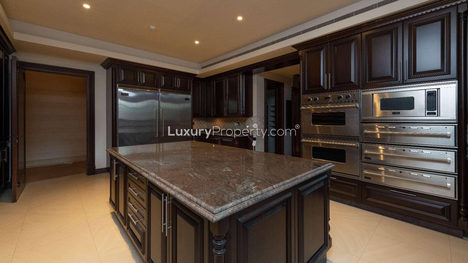 Grand foyer with elegant staircase in 7-bedroom Emirates Hills mansion, Sector L