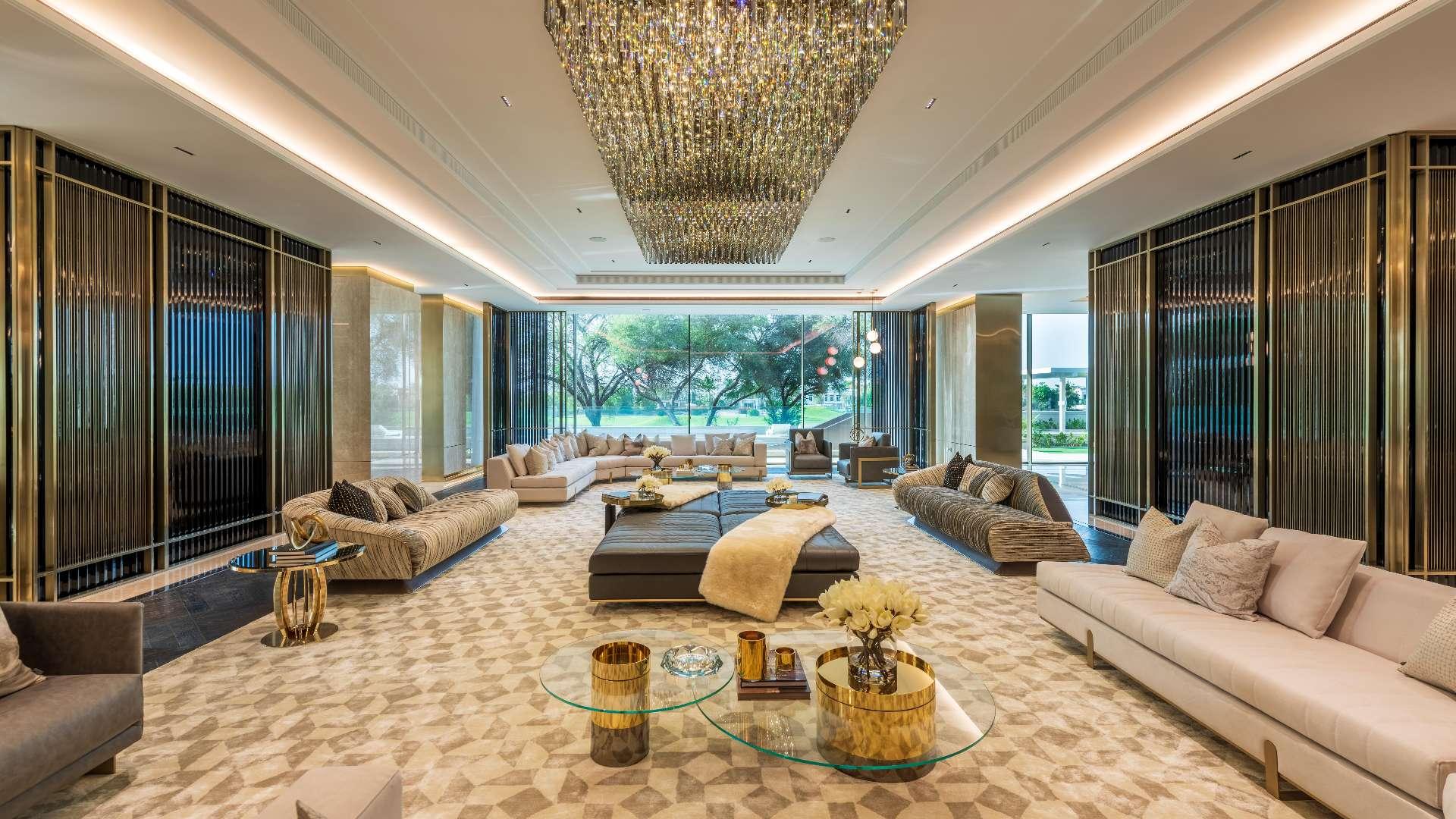 Luxurious grand staircase in Emirates Hills villa, featuring elegant design and modern lighting