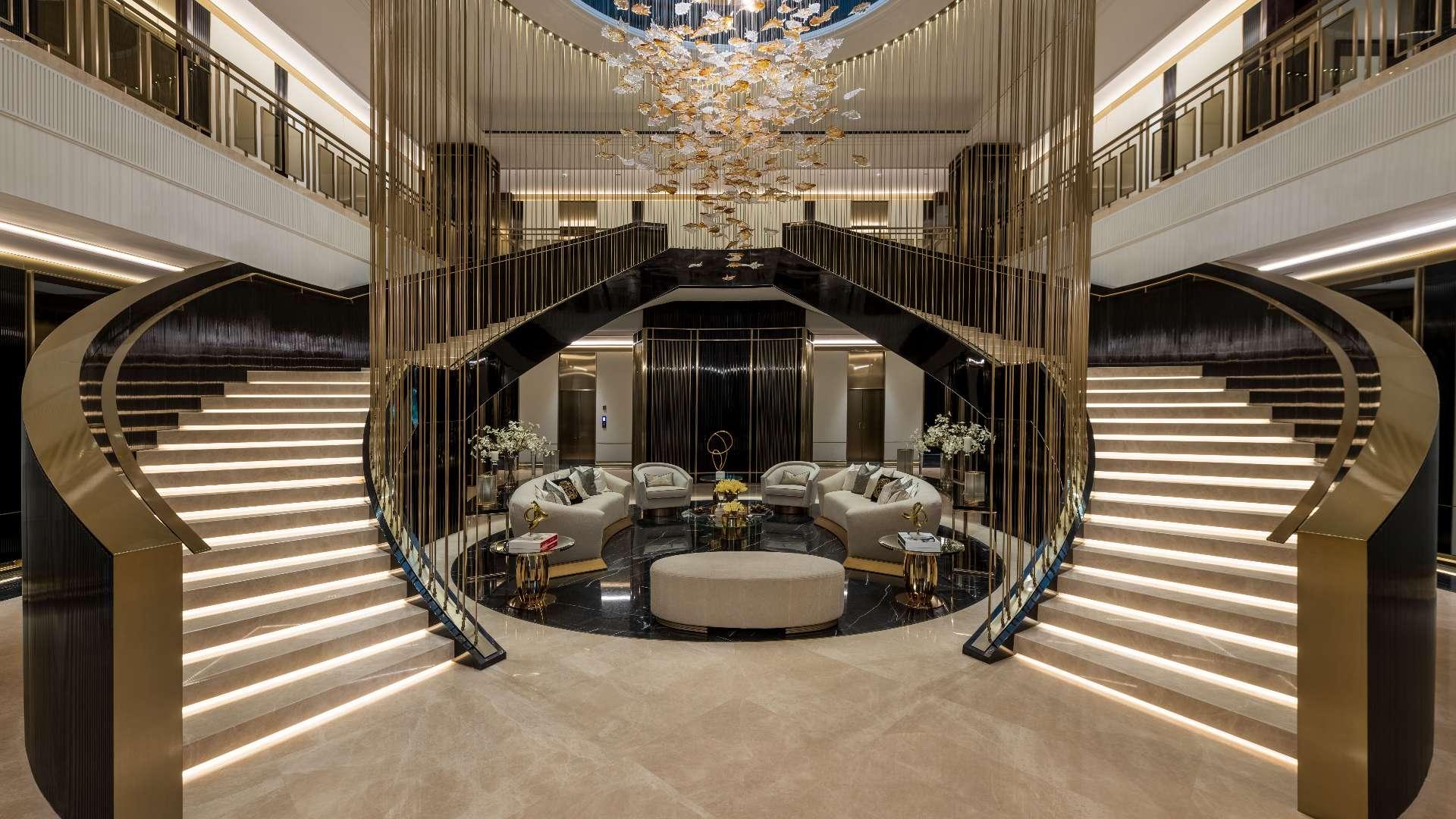 Luxurious 7-bedroom villa with illuminated pool at dusk in Emirates Hills, Sector L