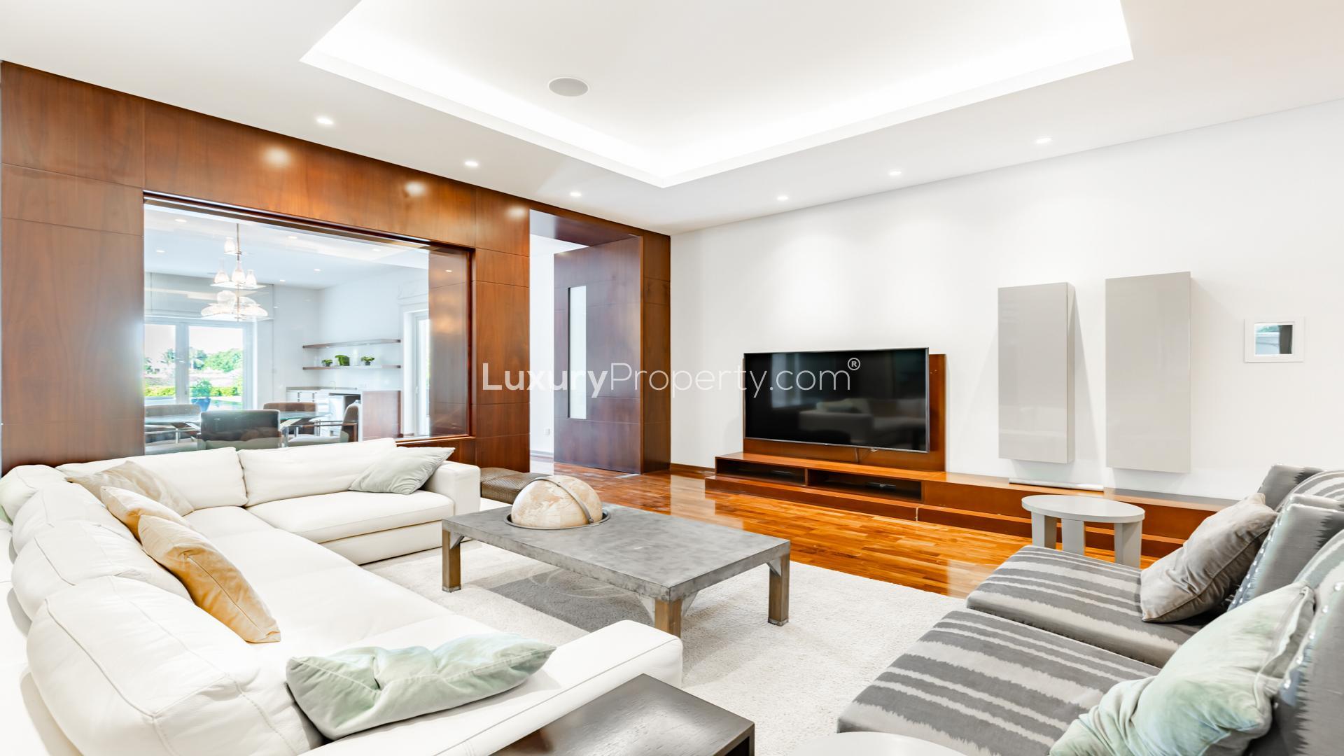 Luxurious poolside view of 8-bedroom villa in Emirates Hills, Sector V, for sale