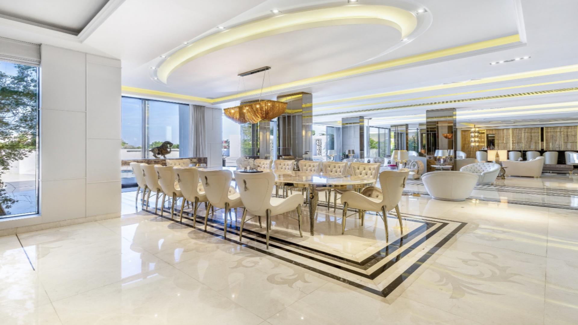 Luxurious living room in 7-bedroom villa, Emirates Hills, featuring elegant decor and spacious layout