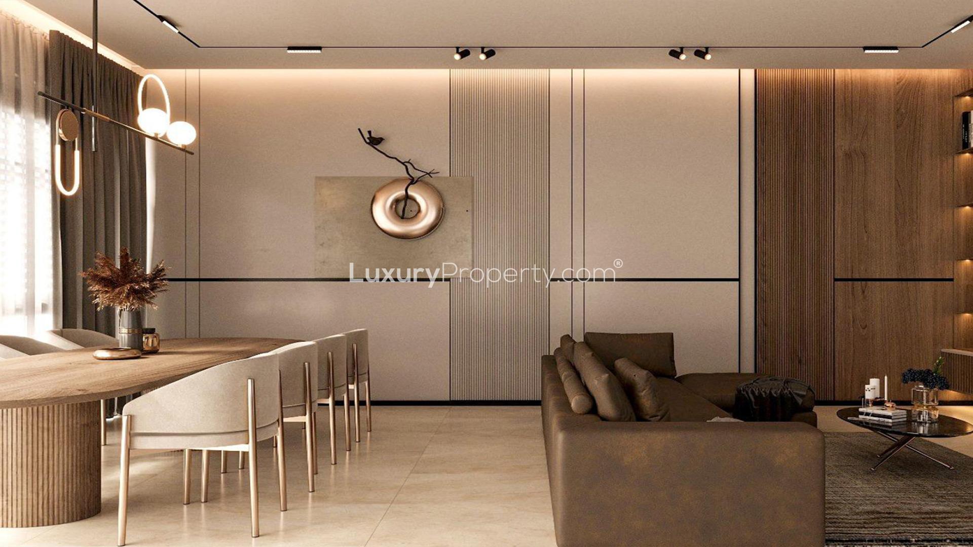 "Modern kitchen in Jumeirah Park villa with sleek cabinets and marble countertops, LP45813.","Luxurious bedroom in ultra-modern Jumeirah Park villa, featuring stylish decor and ambient lighting.",Ultra-modern villa living room with marble TV wall and elegant shelving in Jumeirah Park