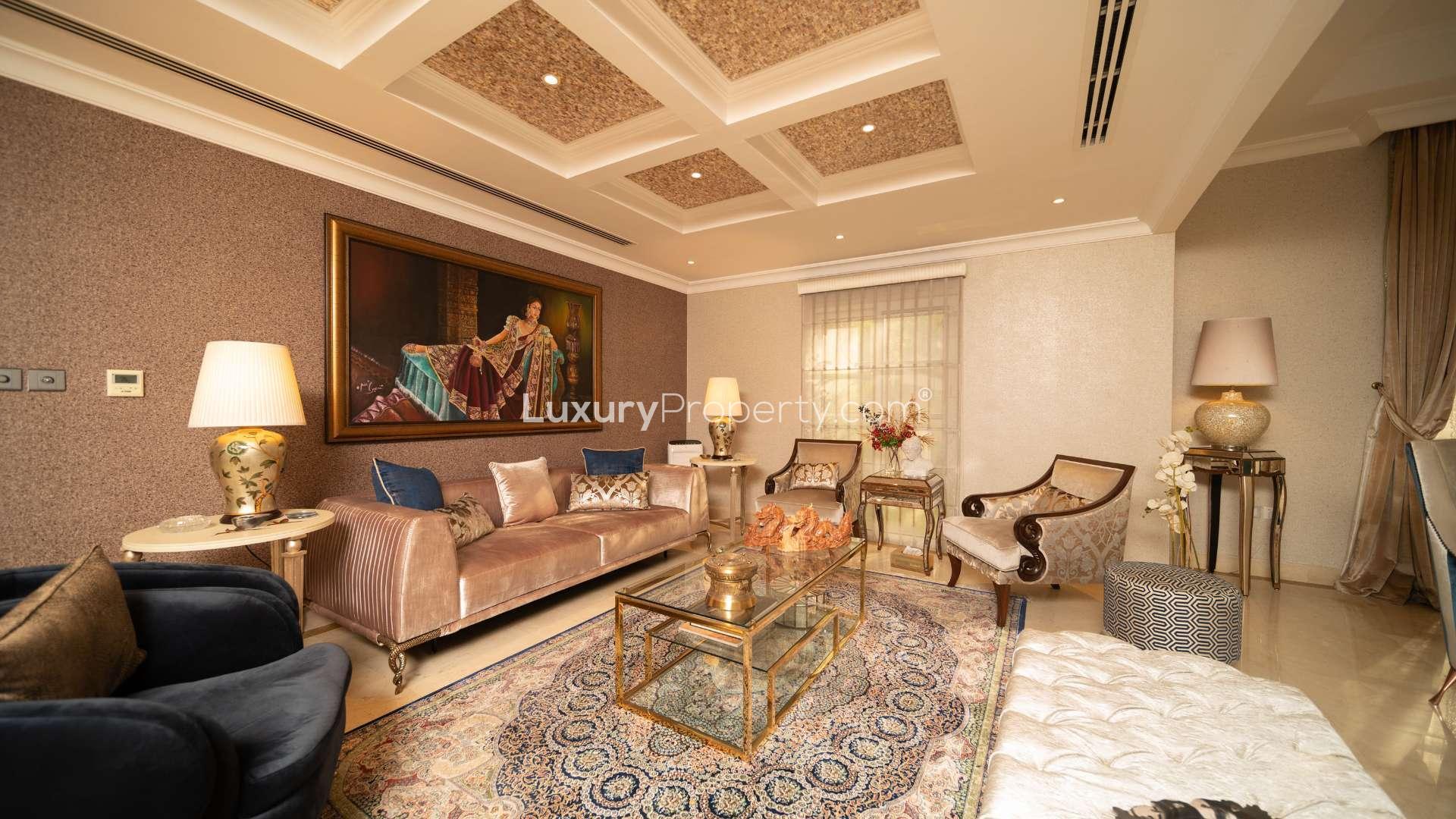 Luxurious villa courtyard with fountain, lush greenery, and elegant seating in The Aldea