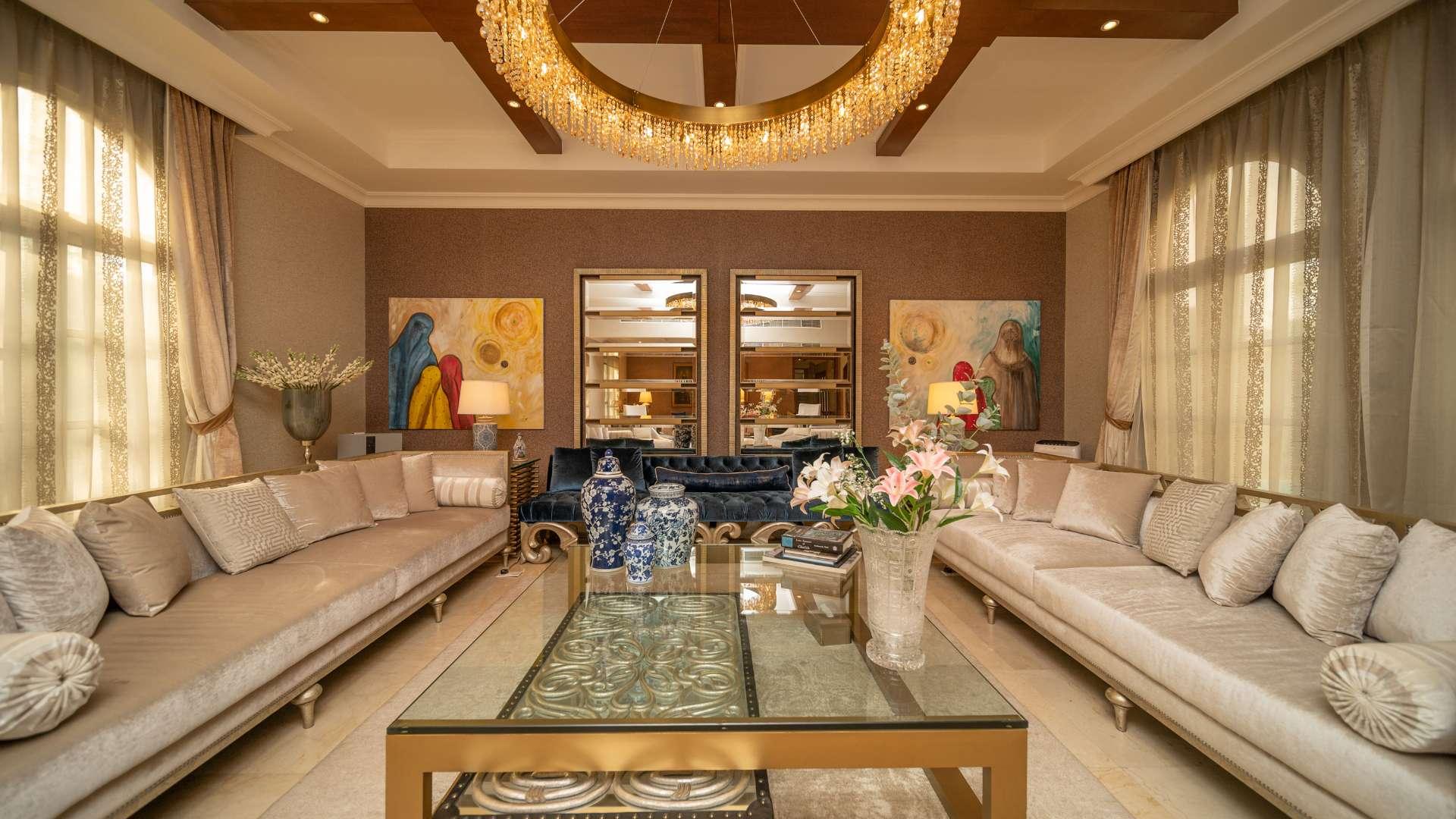 Luxurious living room in stunning villa, The Aldea, with elegant decor and plush seating