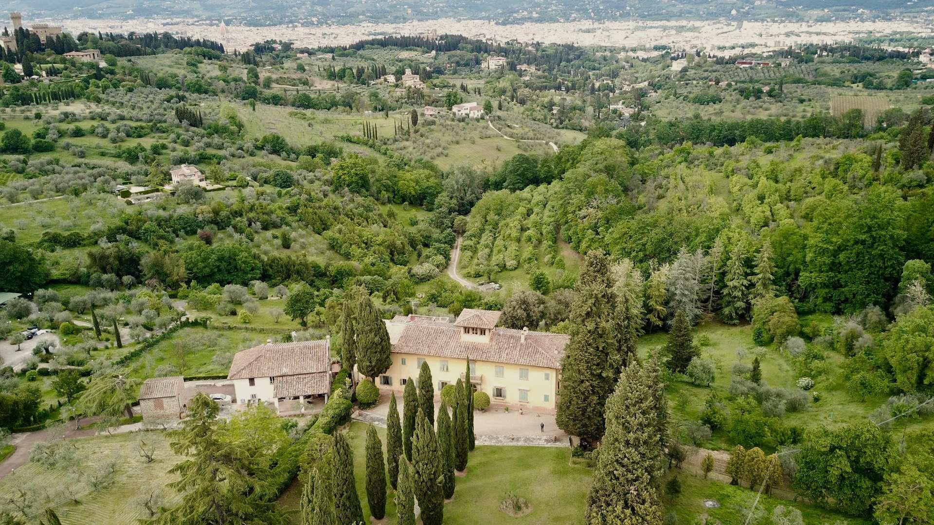 Aerial view of Villa La Costa in Florence surrounded by lush greenery and scenic landscape