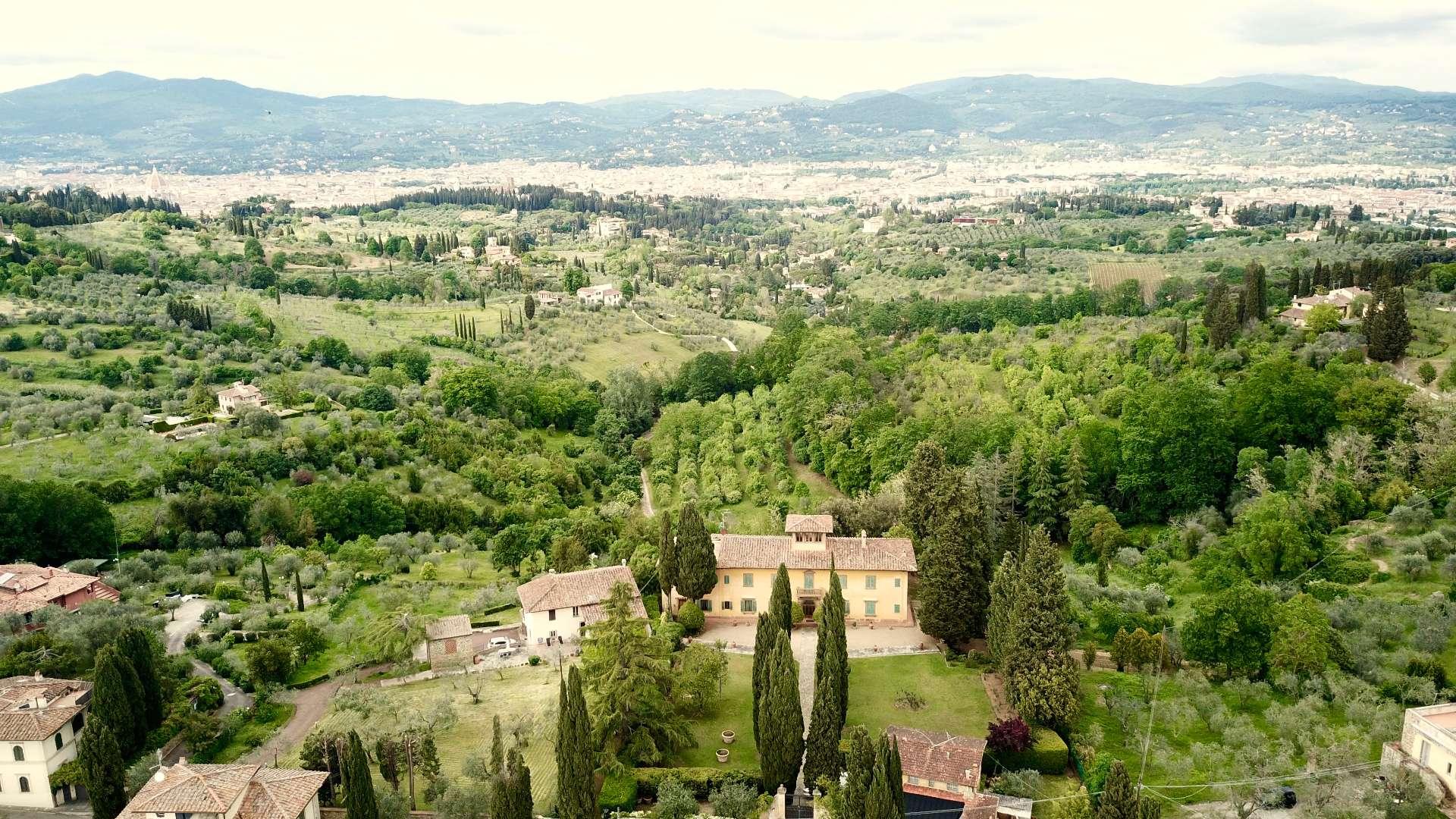 Aerial view of Villa La Costa, Florence, surrounded by lush greenery and scenic hills