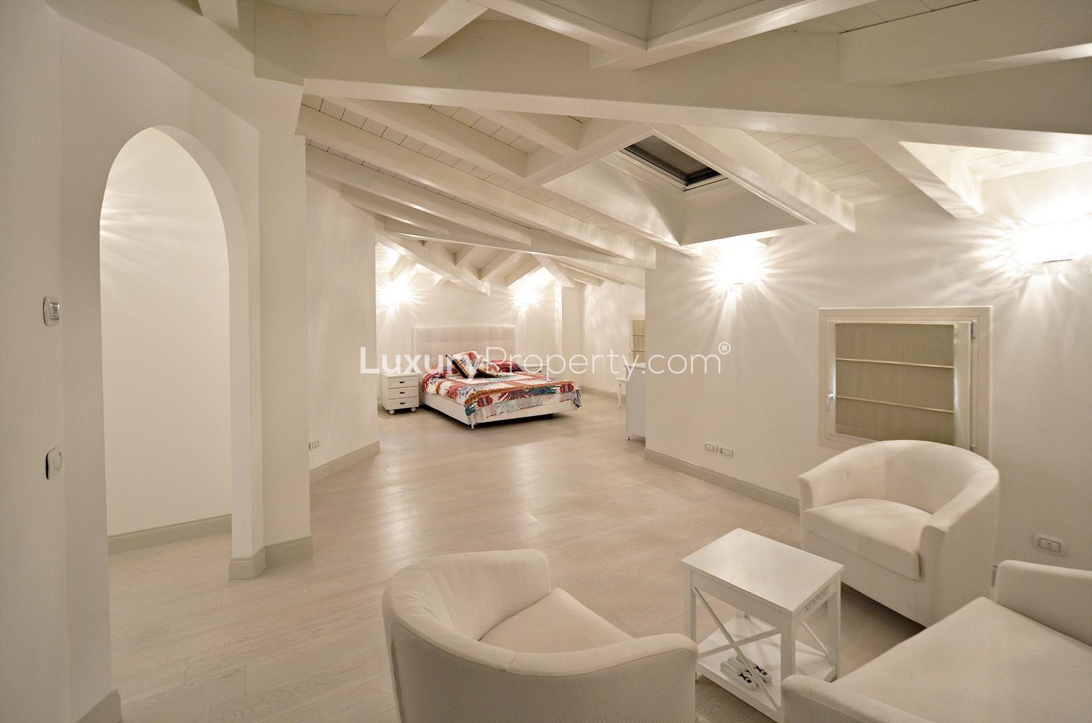 Luxurious bedroom interior in modern Tuscan villa, Lucca's Villa Leonardo, bright and spacious