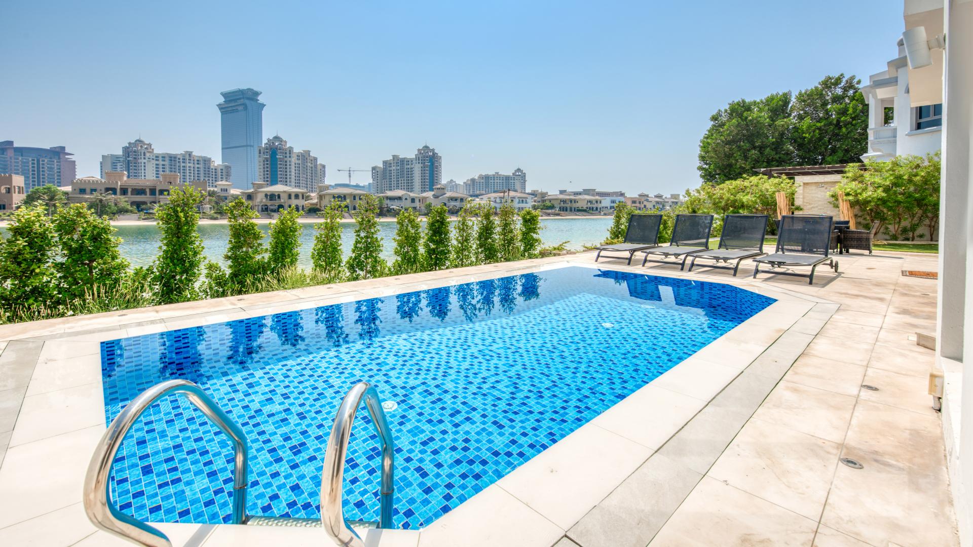 Luxurious living room in Palm Jumeirah Signature Villa with elegant decor and large windows