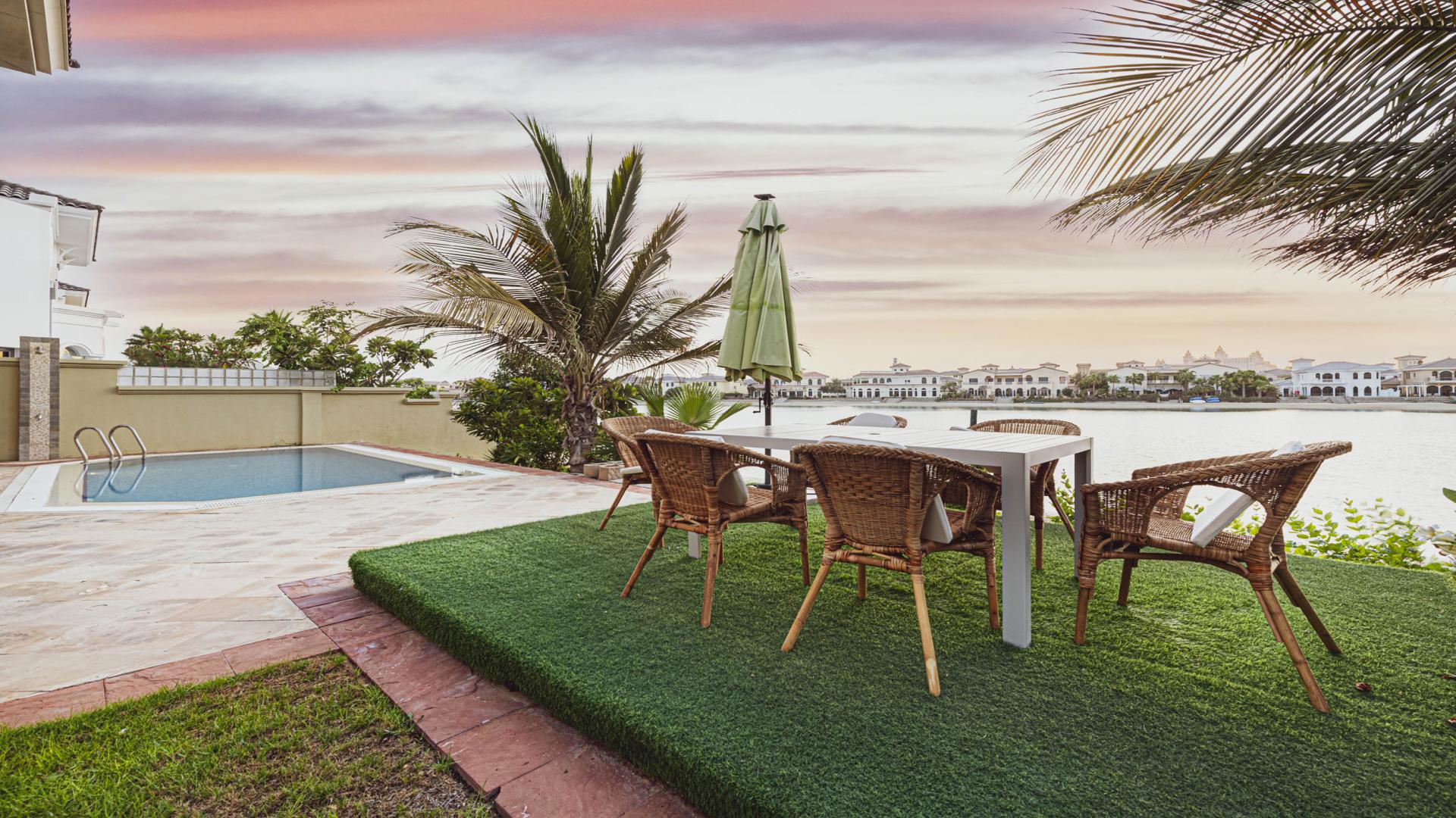 Luxurious living room in Villa Exotica, Palm Jumeirah, featuring elegant decor and spacious layout