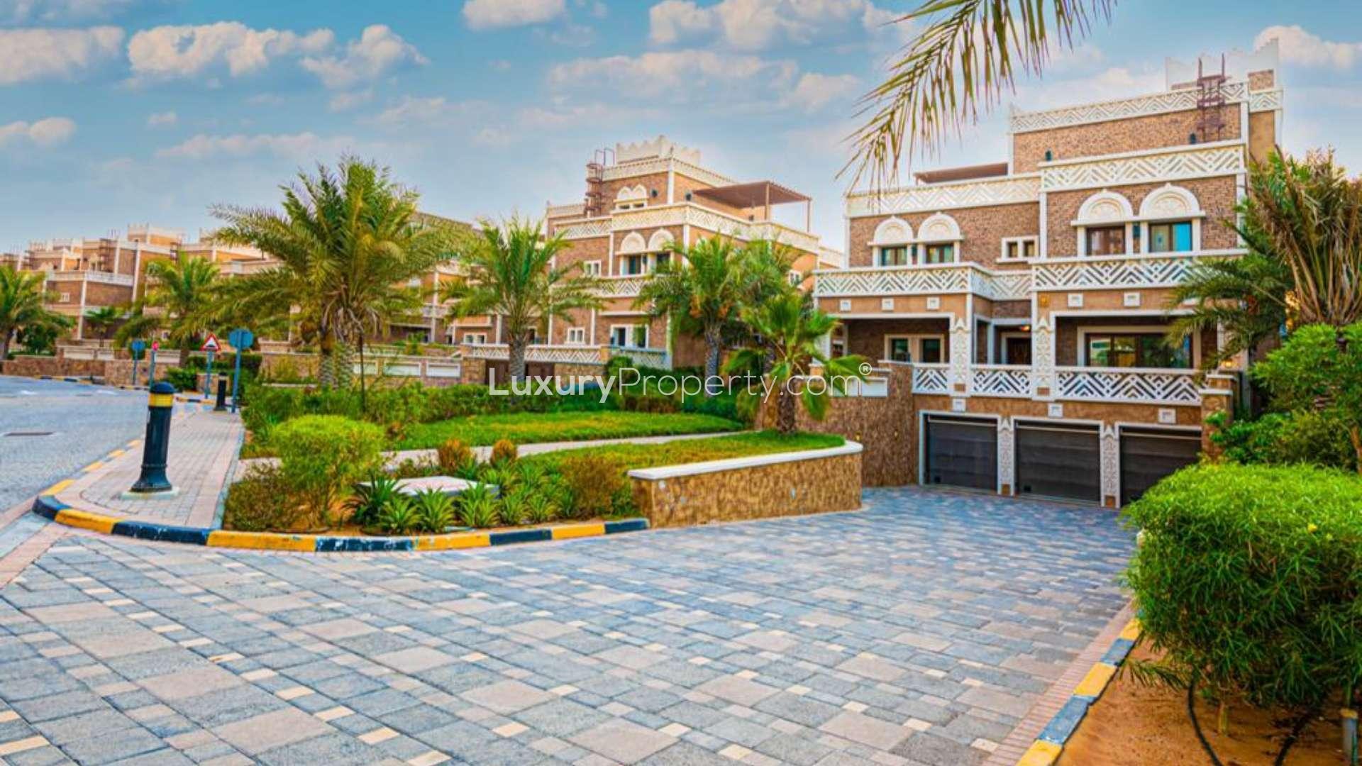 Luxurious villa pool view in Kingdom of Sheba, Palm Jumeirah, surrounded by palm trees